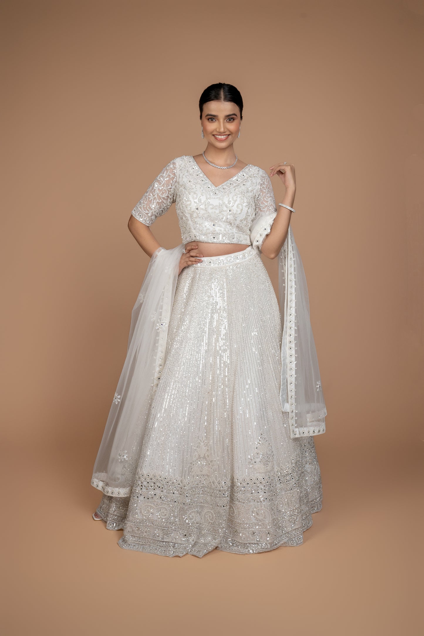 hand work lehenga in white colour and heavy border.