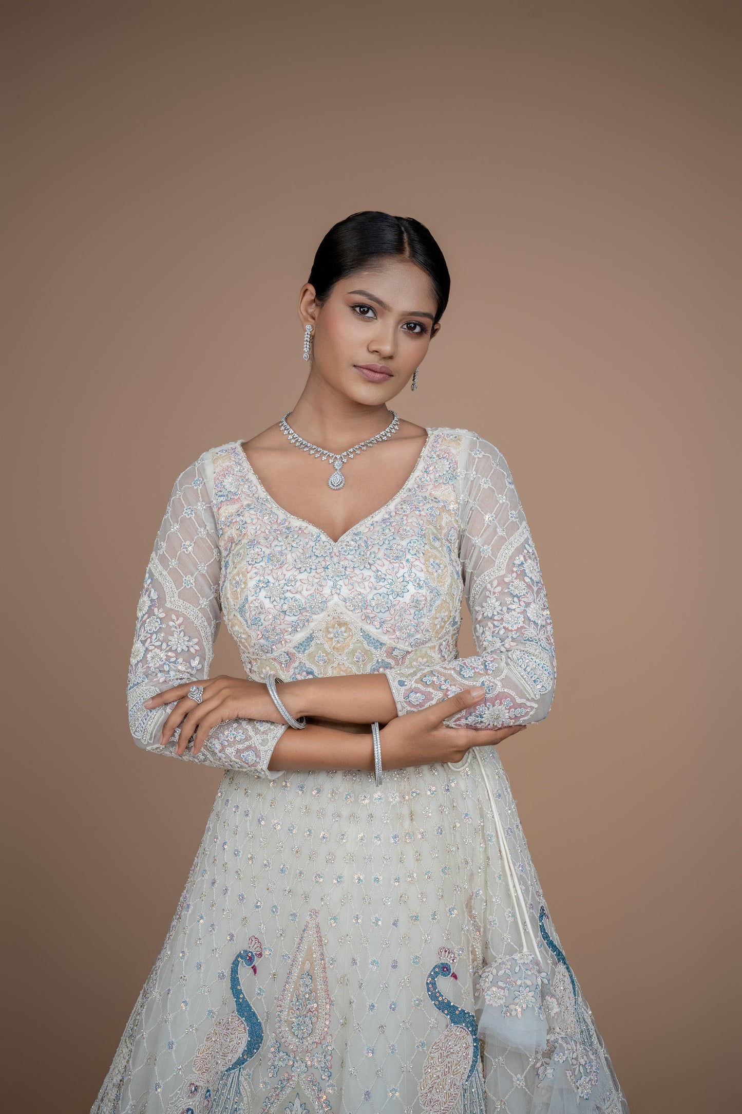Ivory Peacock design lehenga best suited for engagement or reception wear