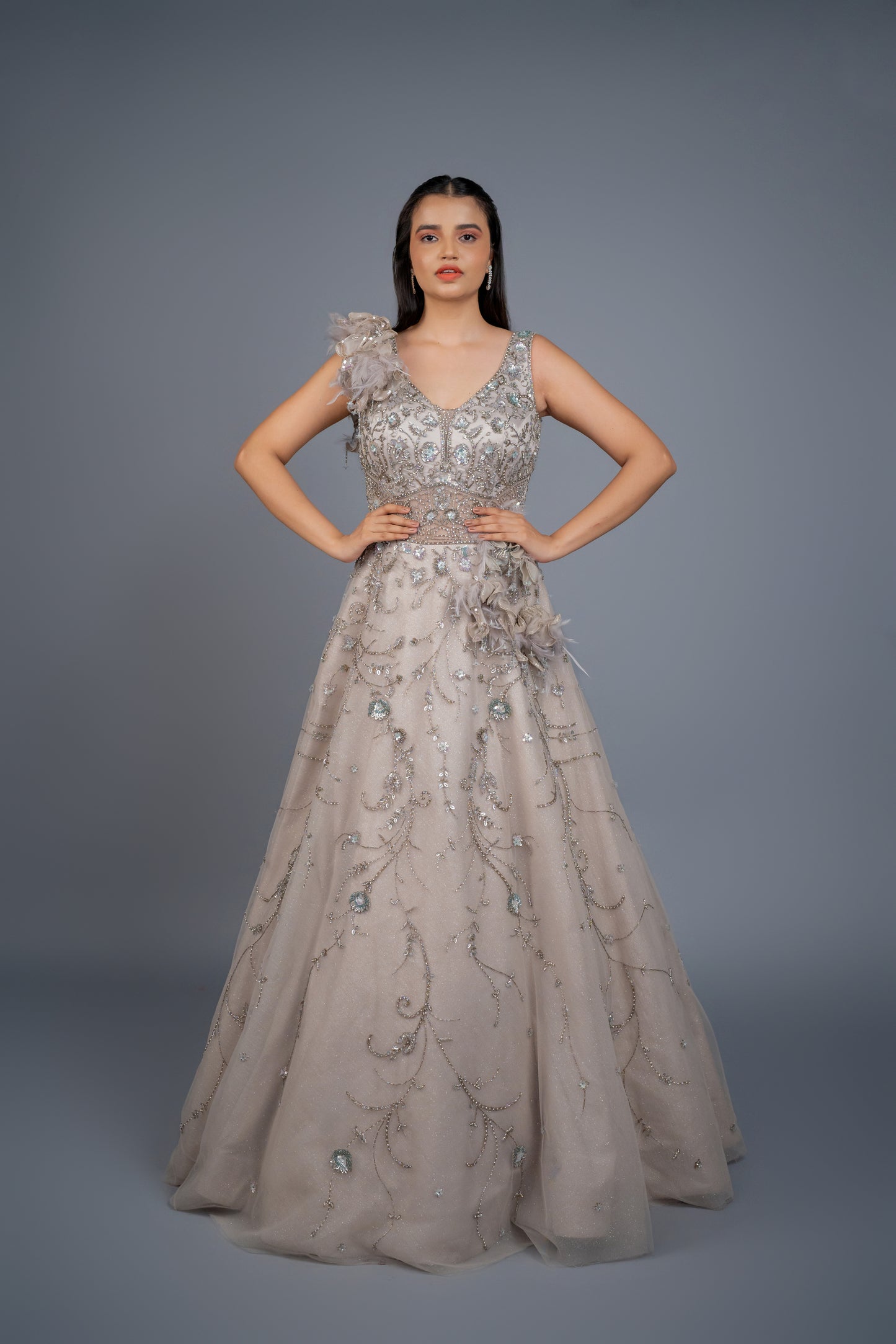 dusly grey handwork gown with feathers touch.
