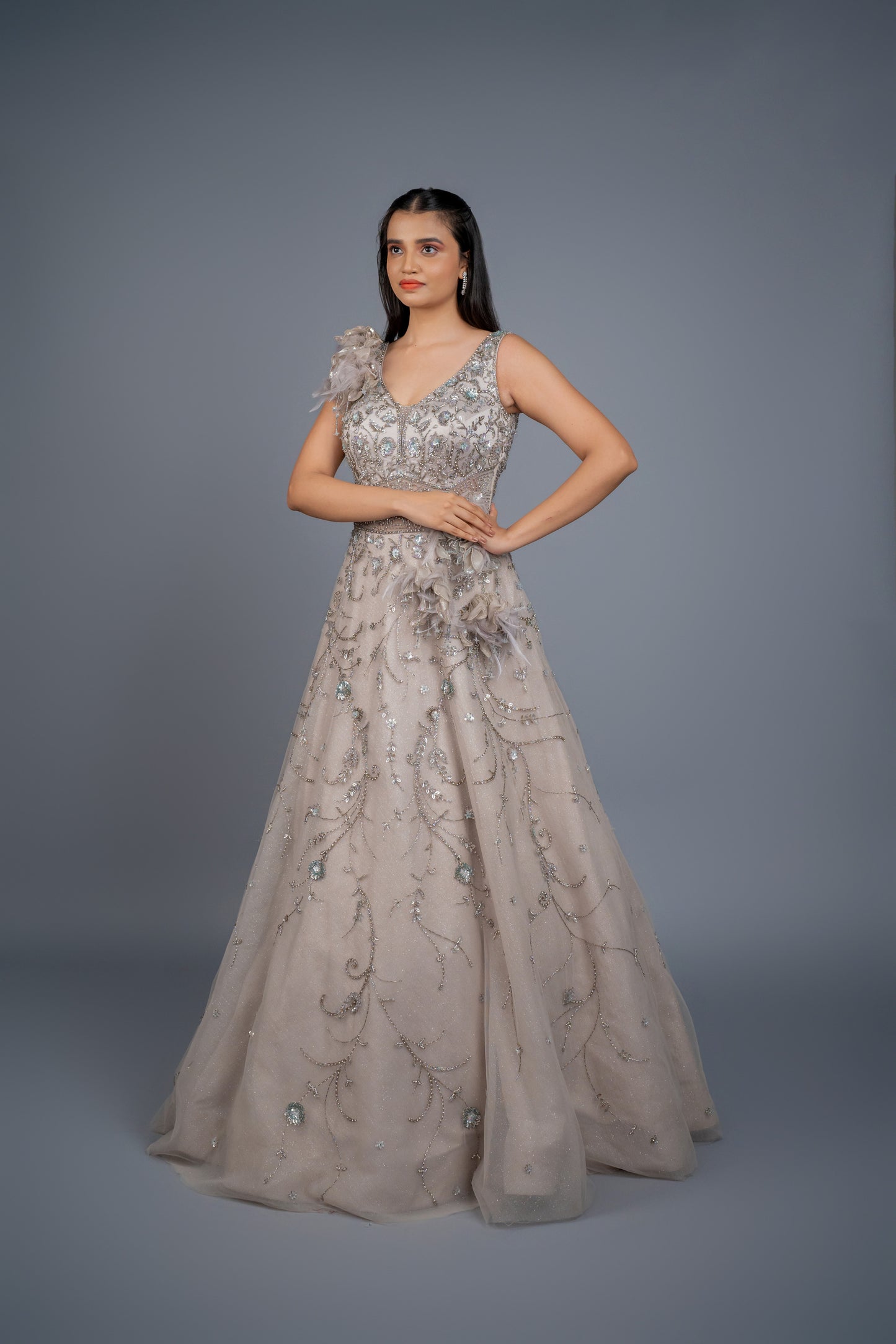 dusly grey handwork gown with feathers touch.
