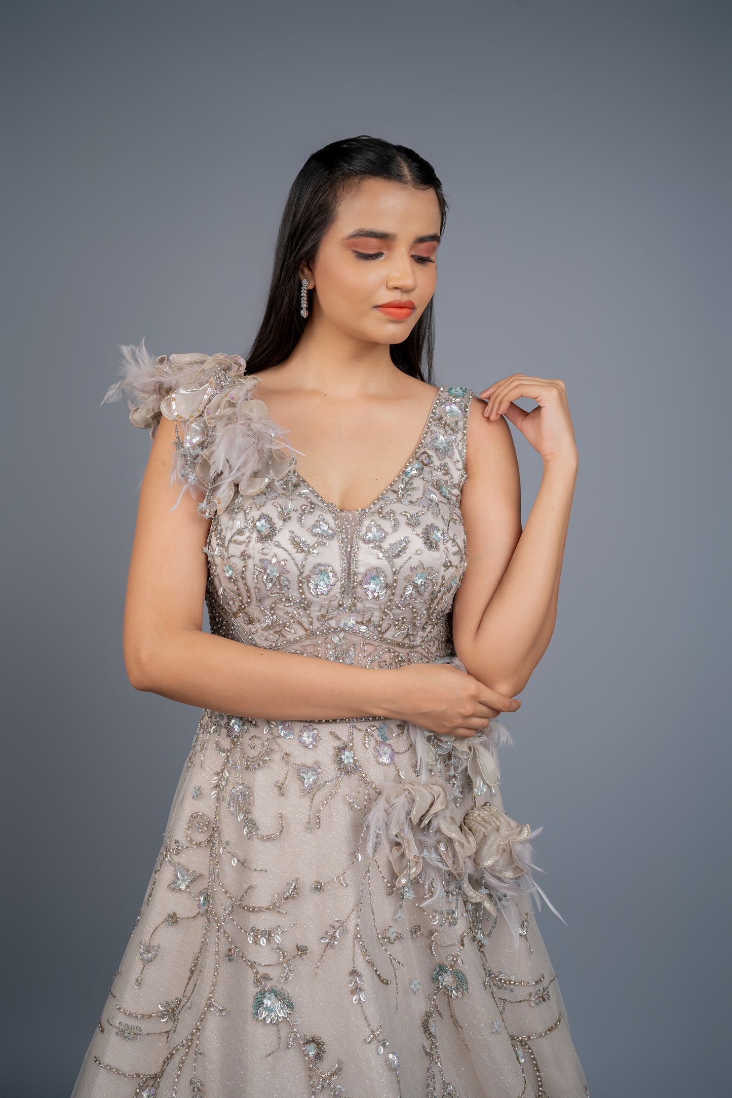 dusly grey handwork gown with feathers touch.