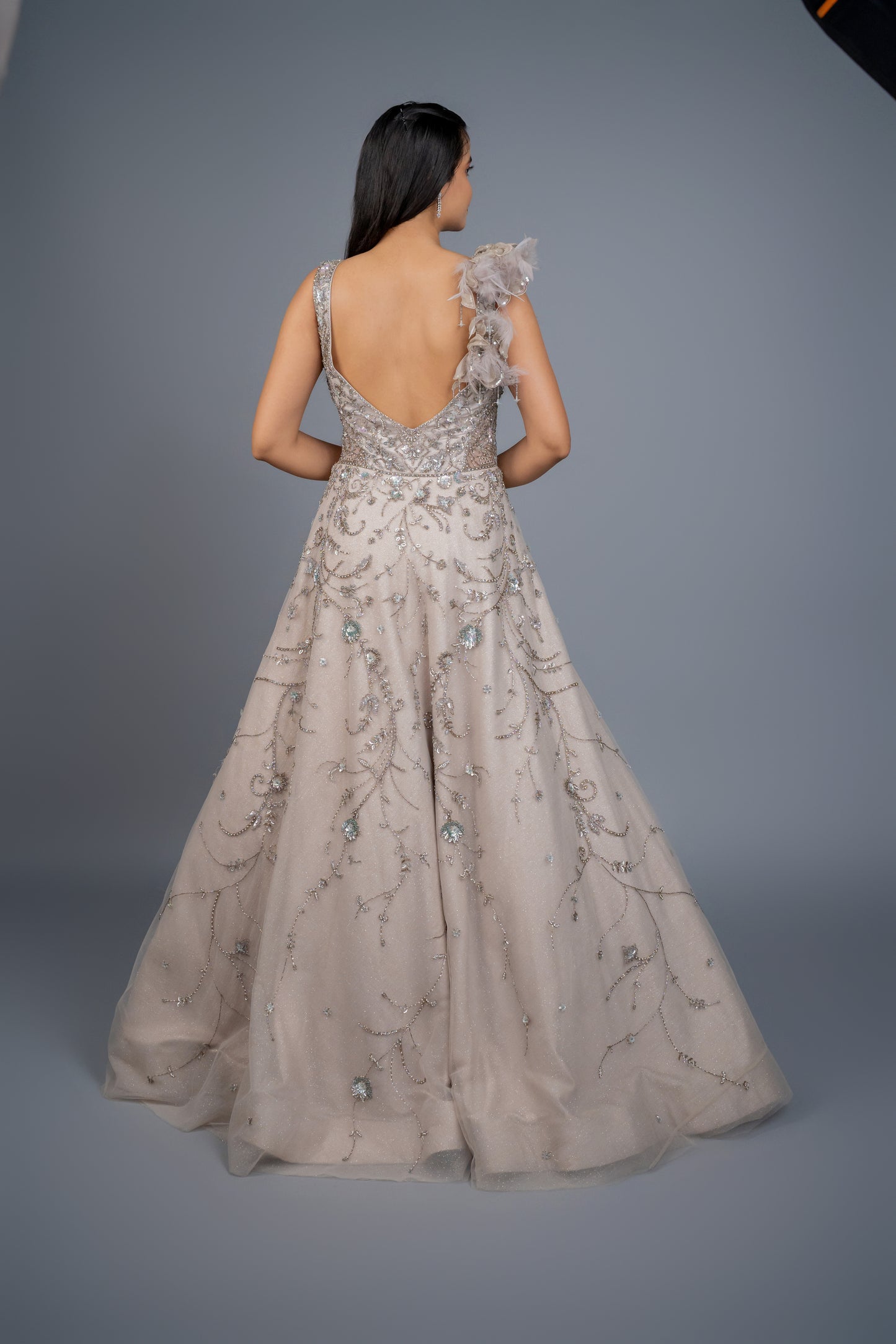 dusly grey handwork gown with feathers touch.