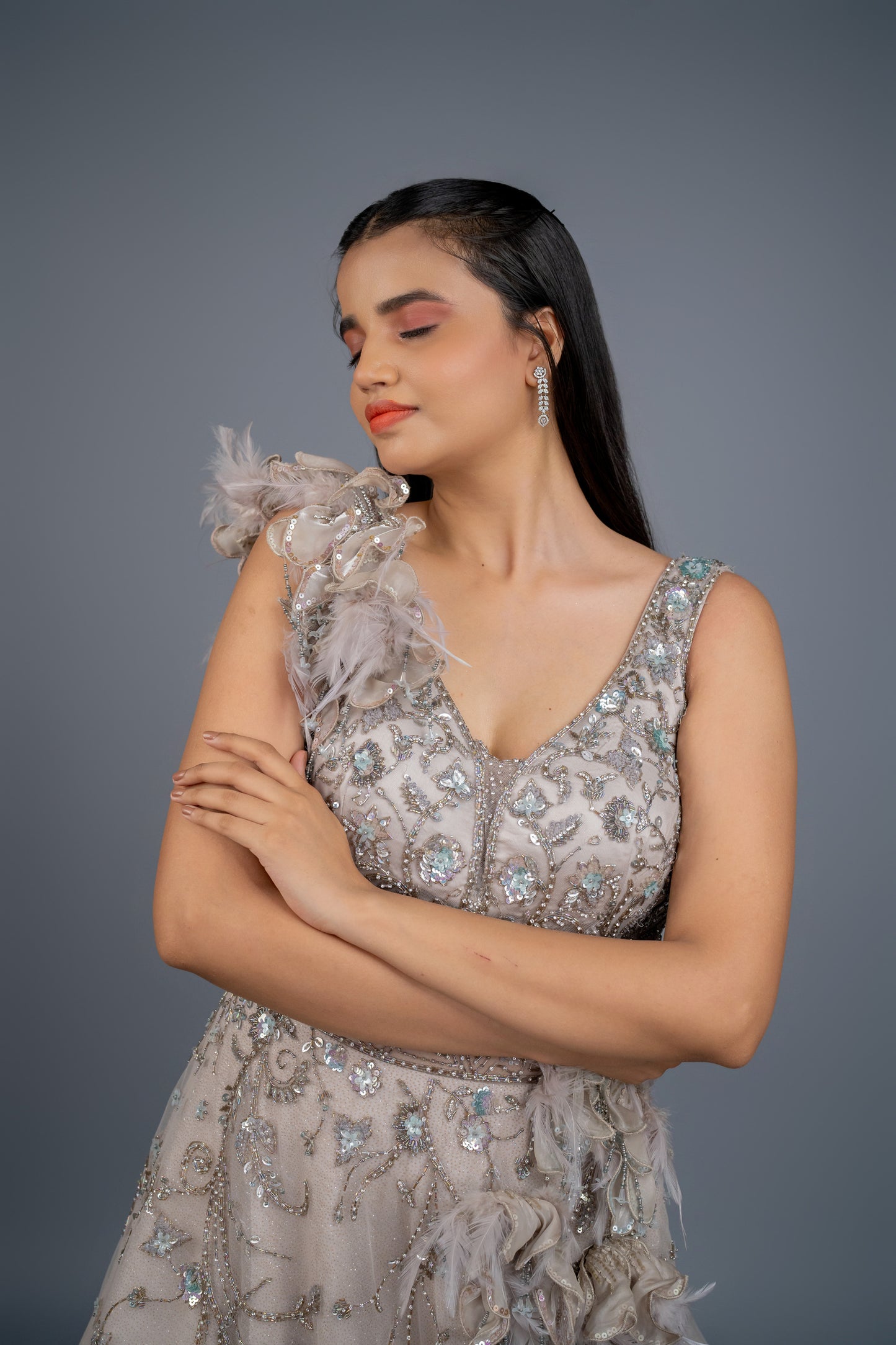 dusly grey handwork gown with feathers touch.