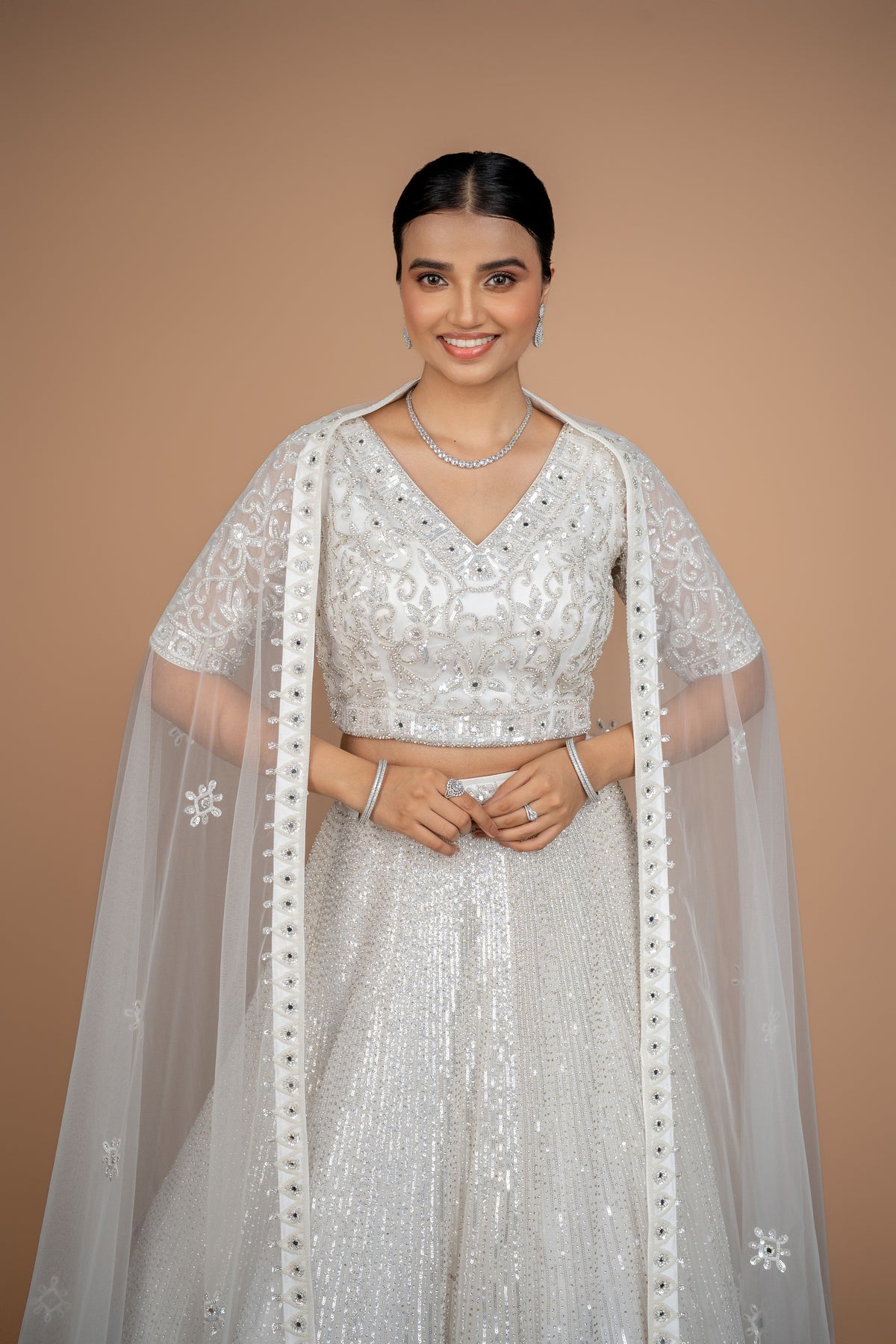 hand work lehenga in white colour and heavy border.