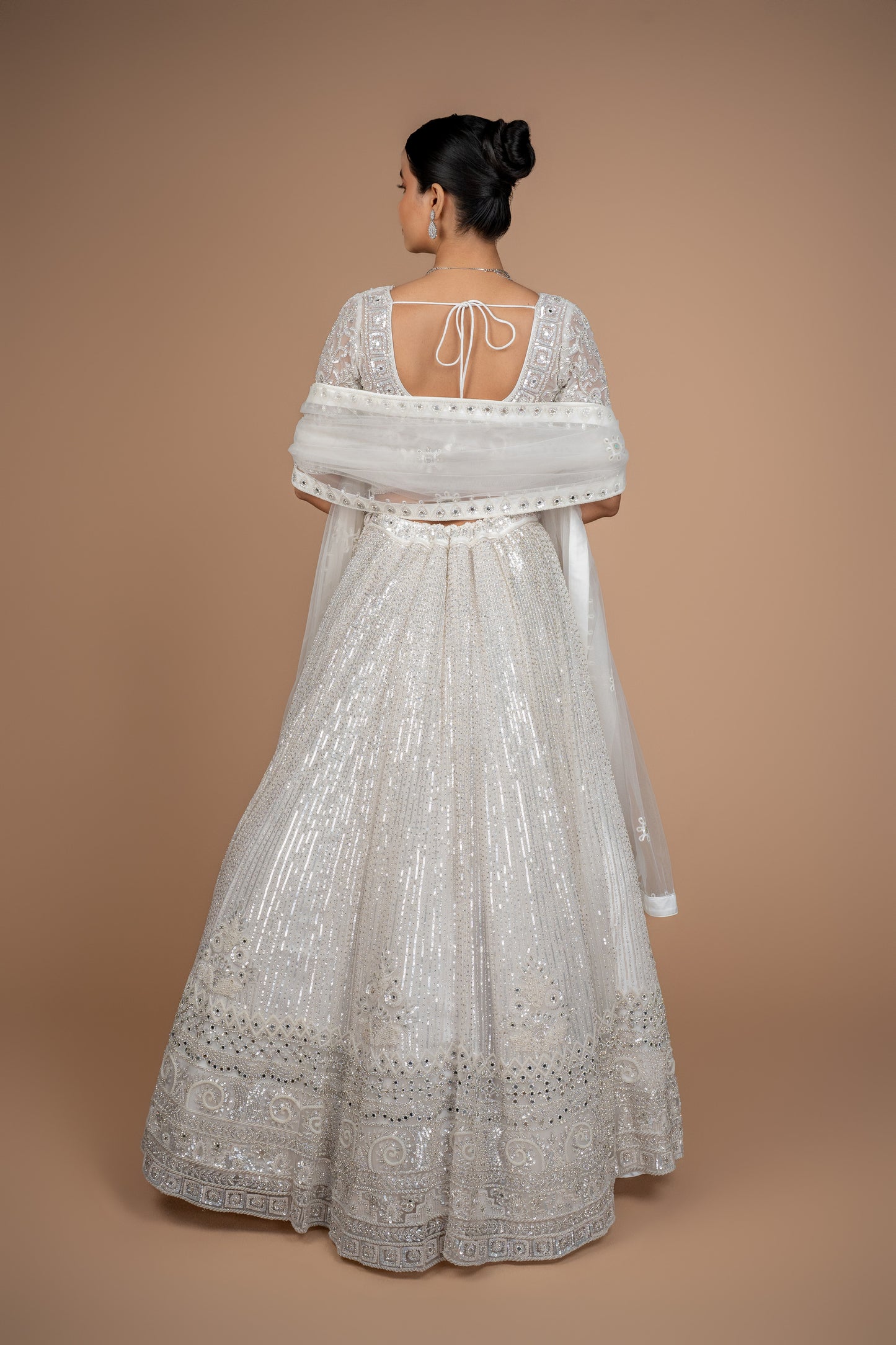 hand work lehenga in white colour and heavy border.