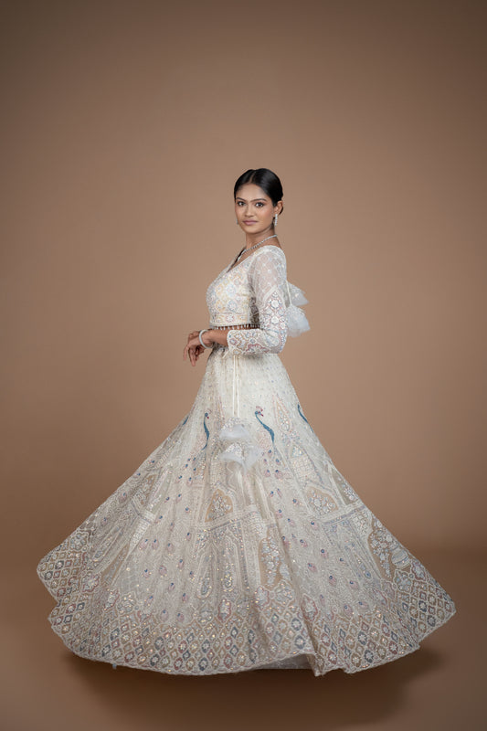 Ivory Peacock design lehenga best suited for engagement or reception wear