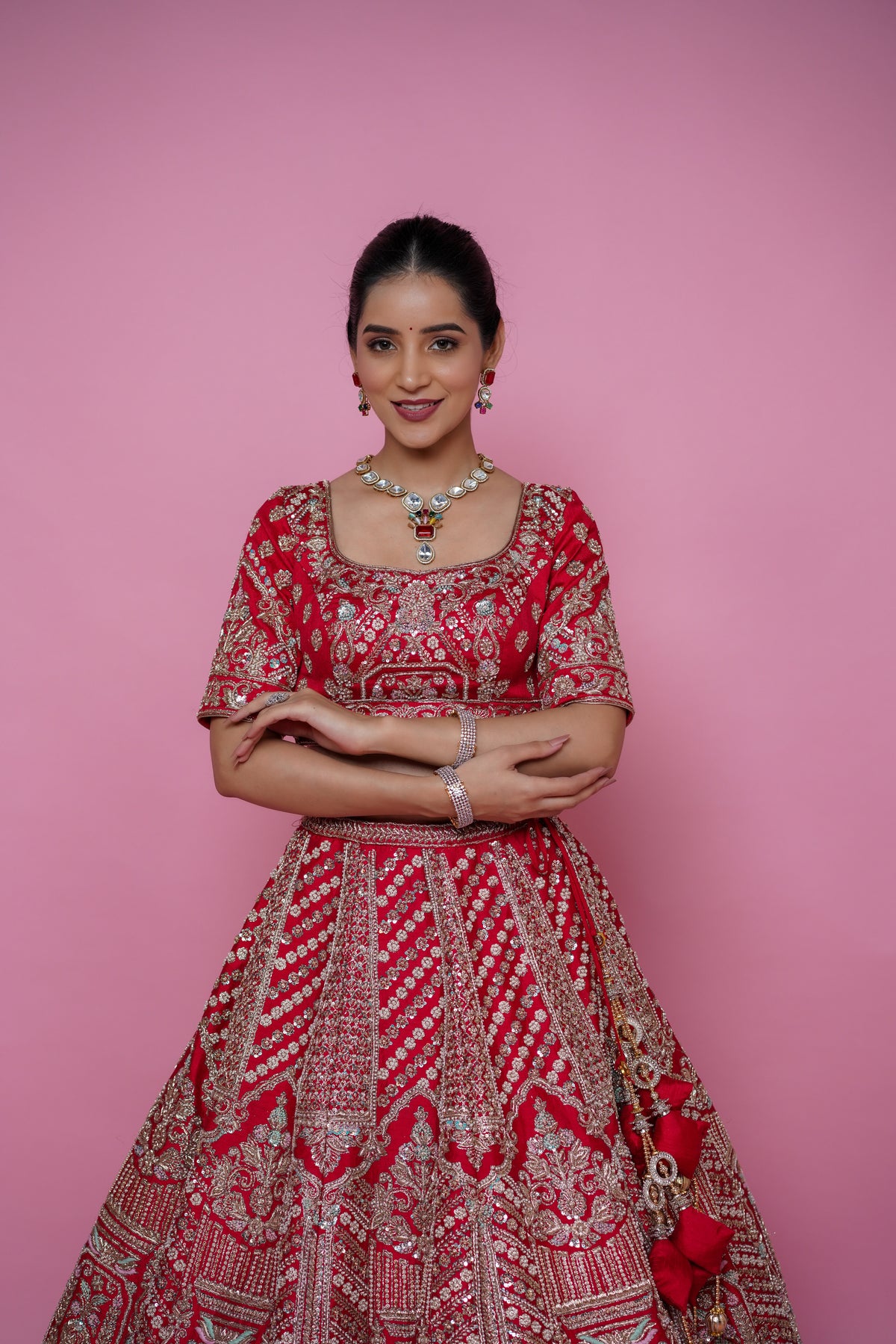 red silk fabric zardoshi lehenga.