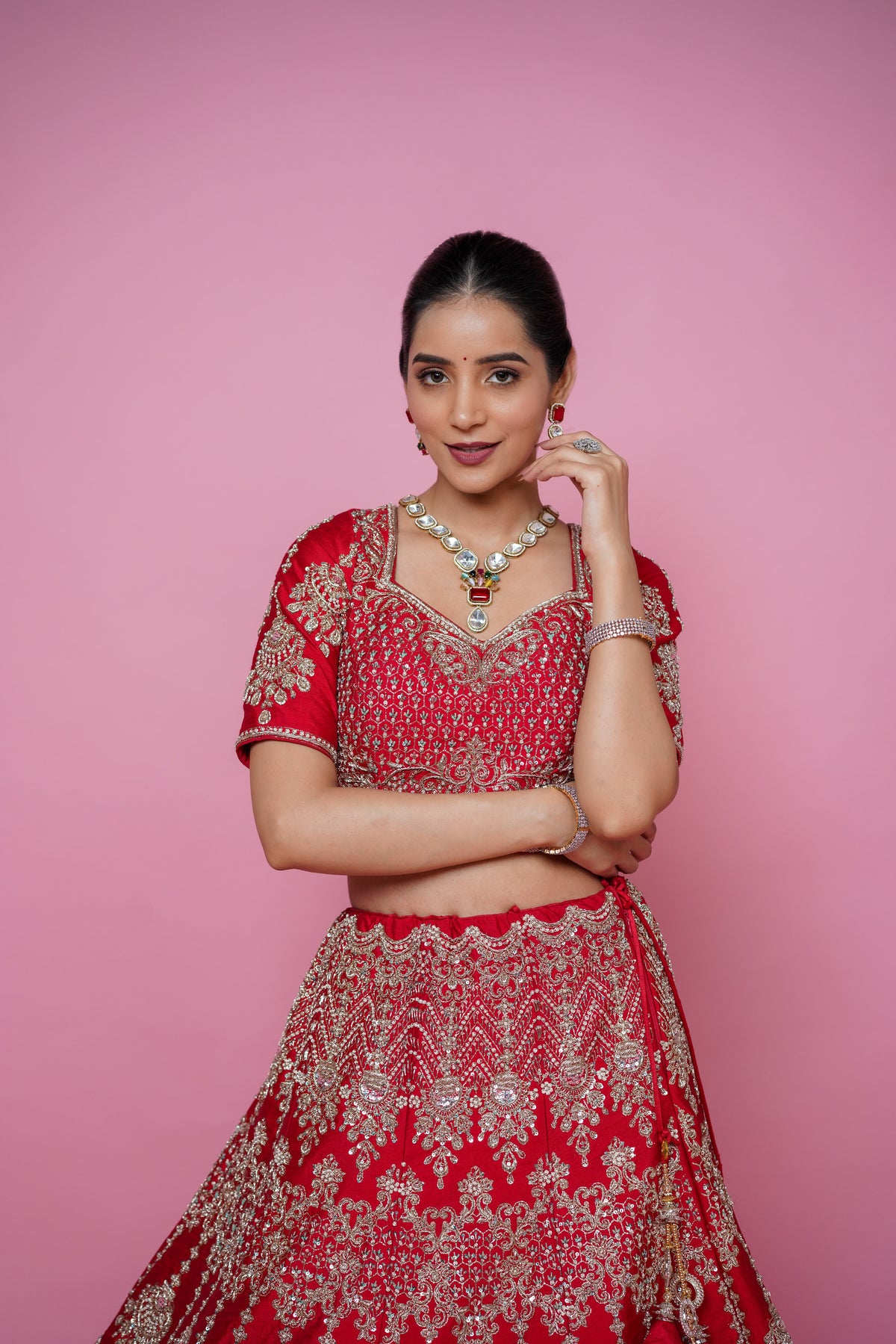 red silk fabric zardoshi lehenga.
