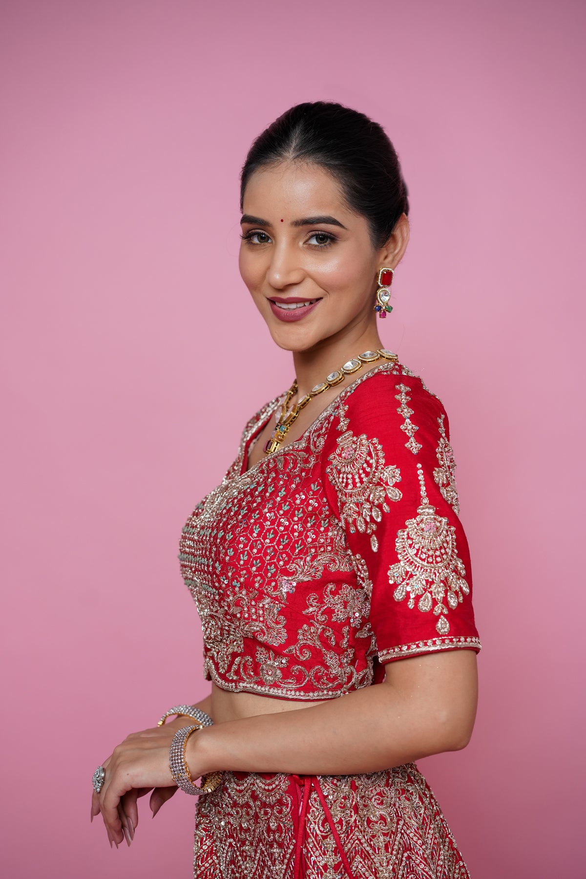 red silk fabric zardoshi lehenga.