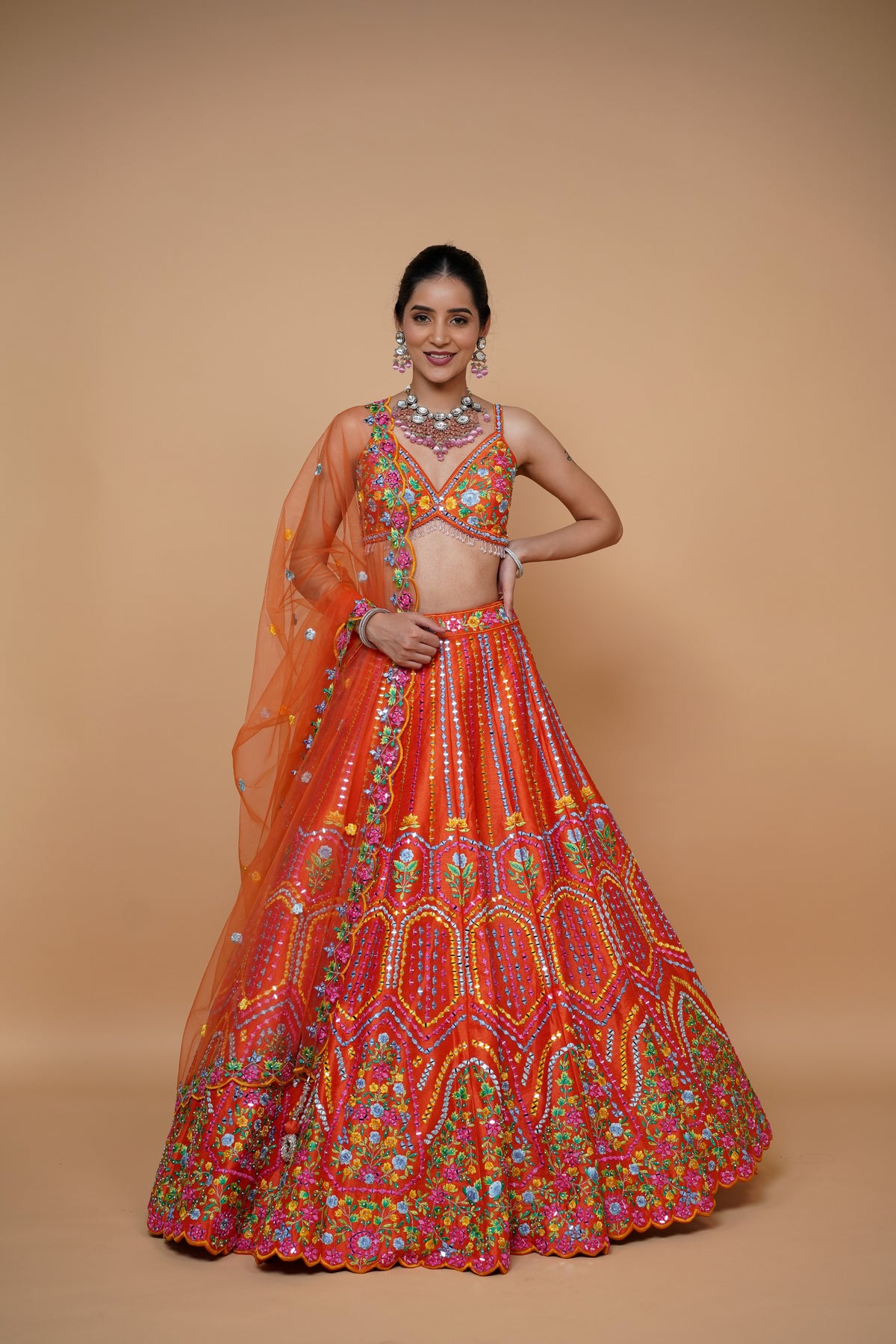 rust colour lehenga with mirror work and designer blouse design and net dupatta