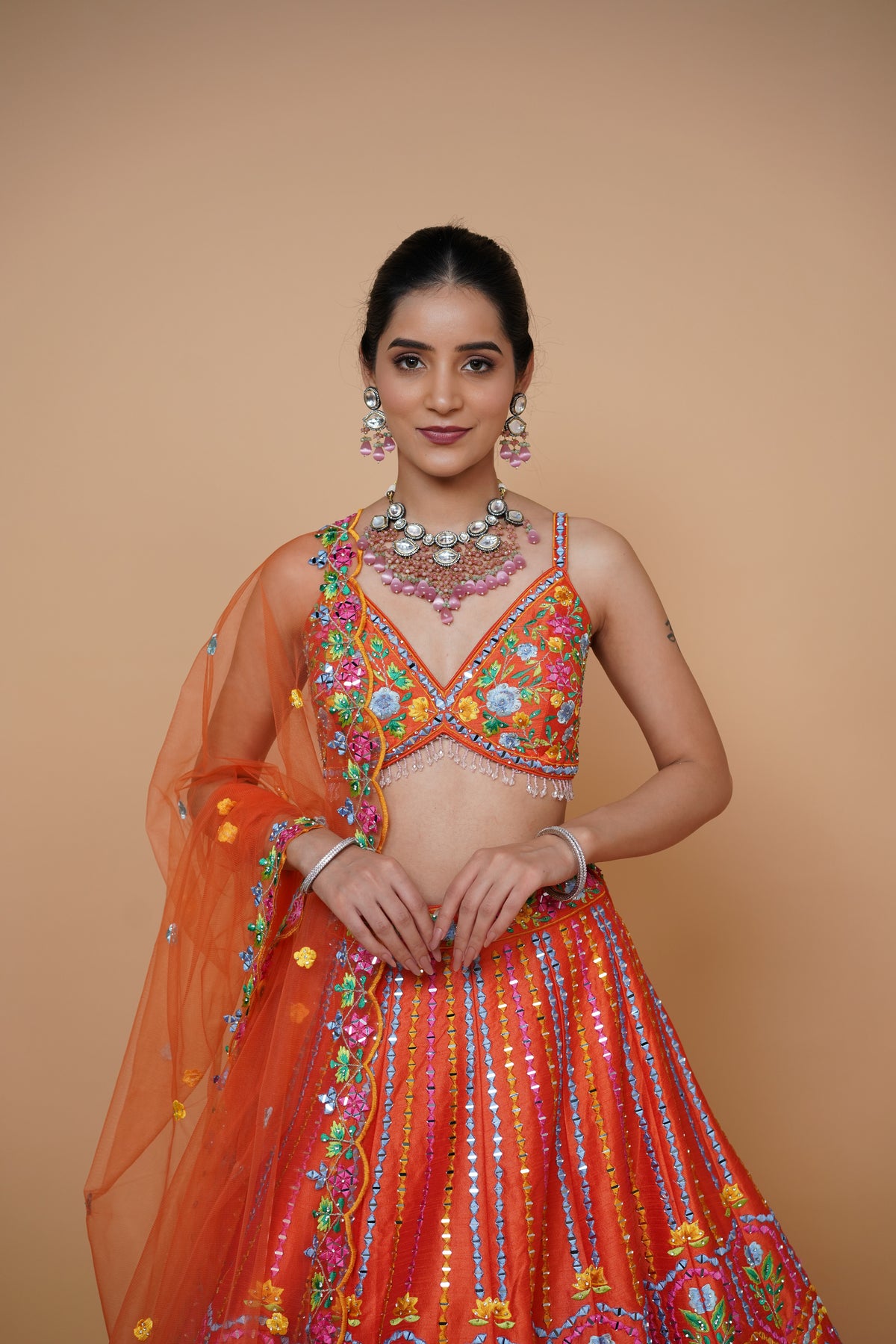 rust colour lehenga with mirror work and designer blouse design and net dupatta