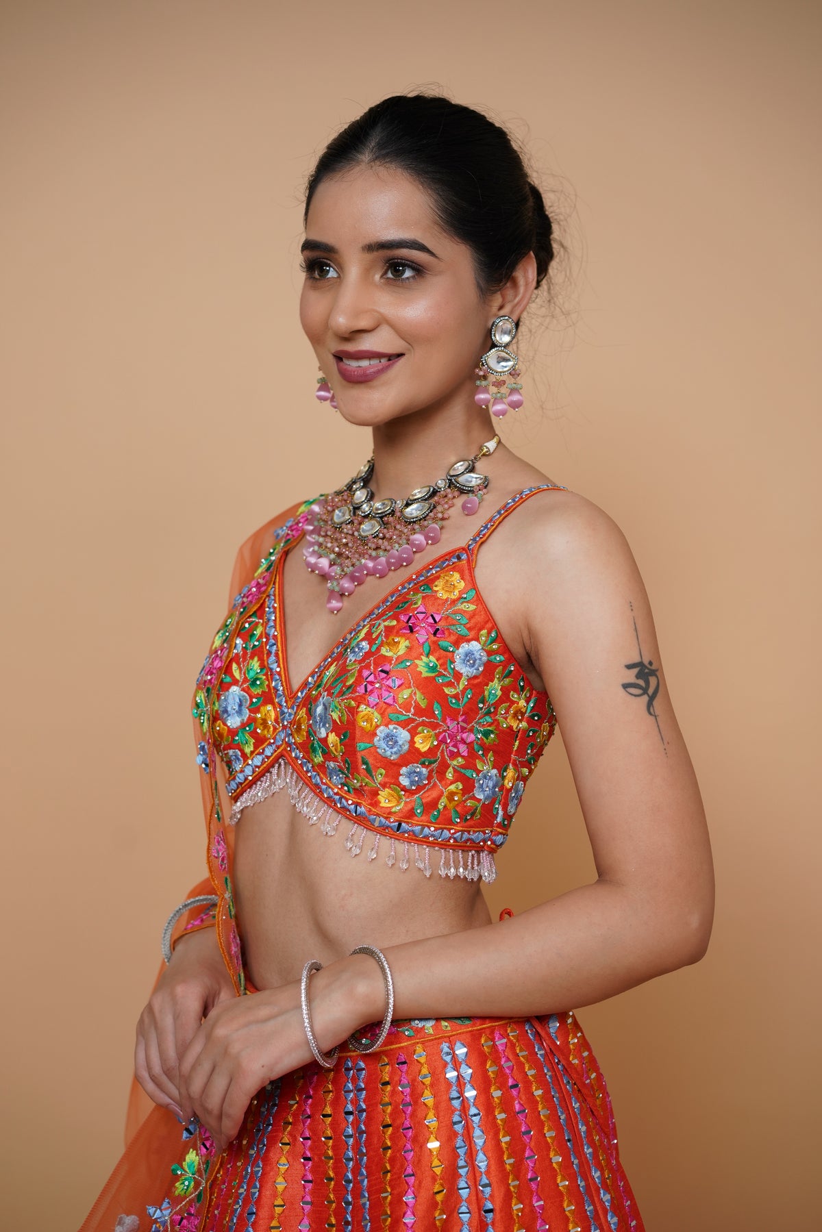 rust colour lehenga with mirror work and designer blouse design and net dupatta