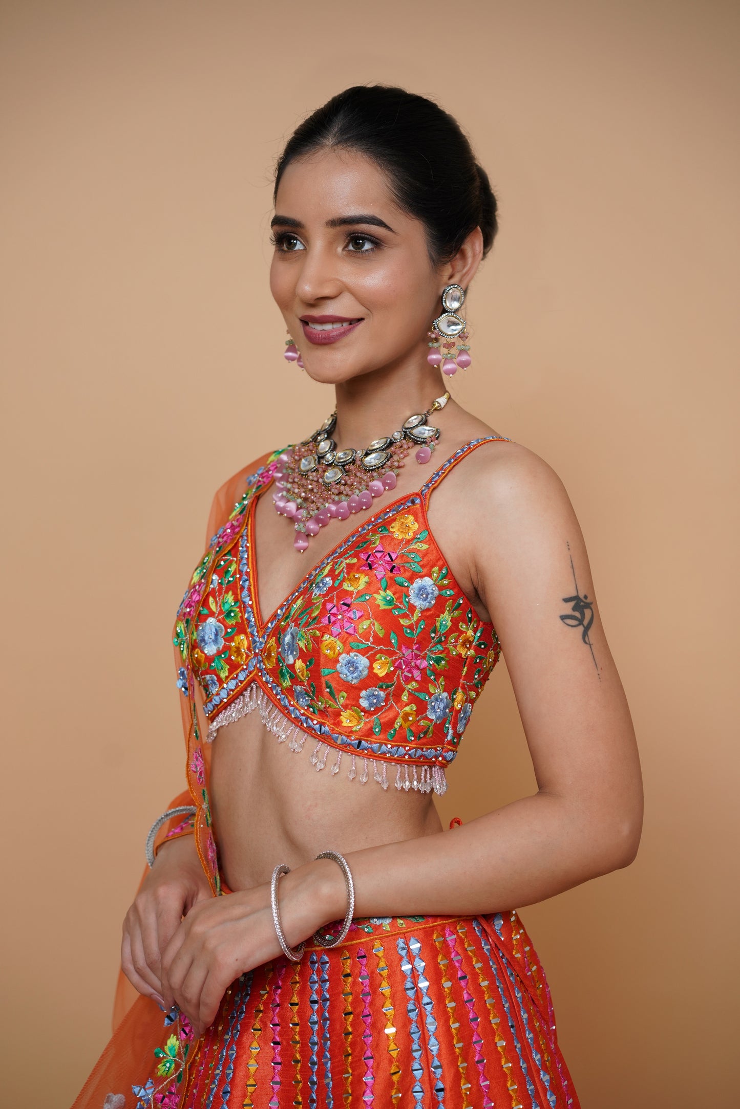 rust colour lehenga with mirror work and designer blouse design and net dupatta