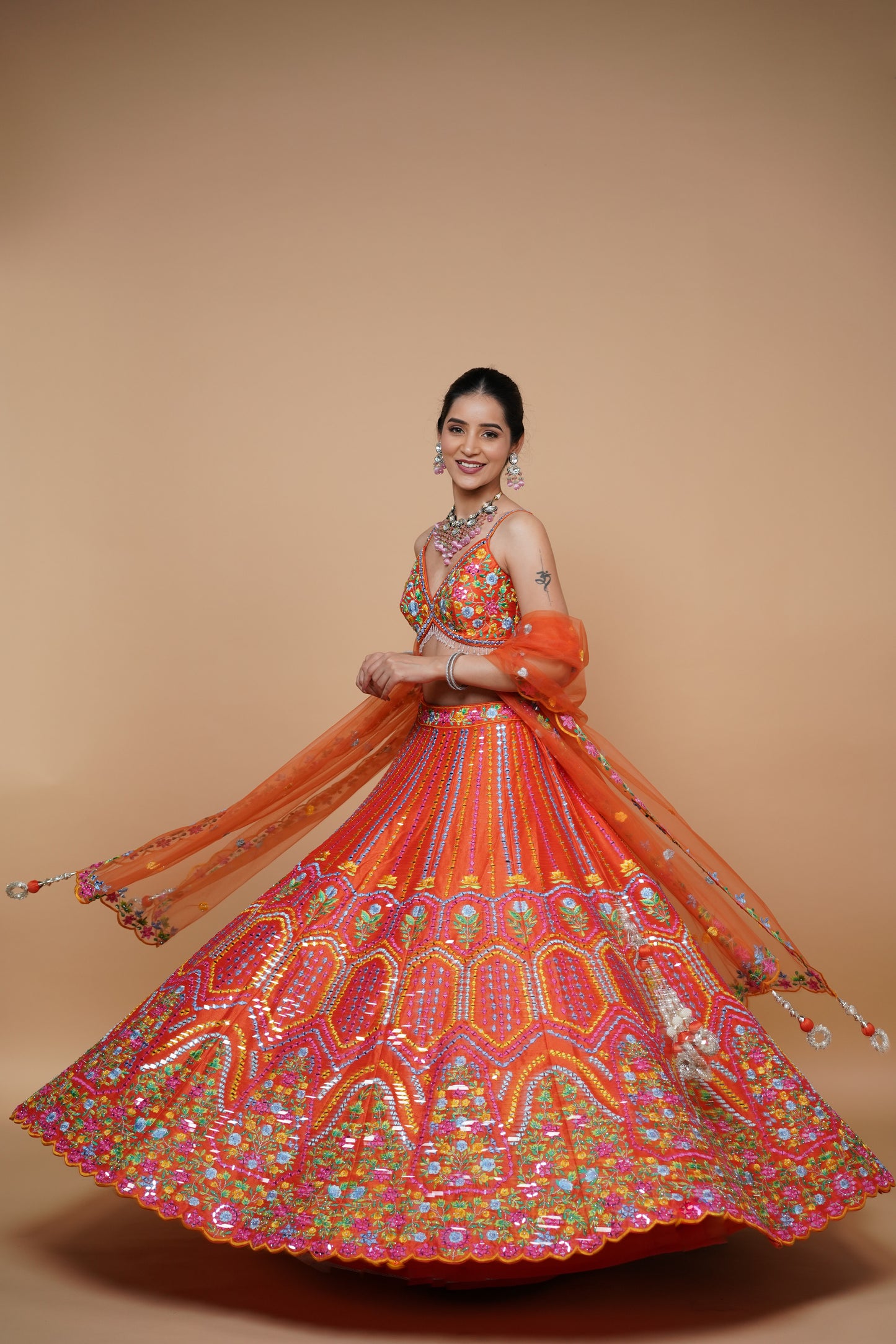 rust colour lehenga with mirror work and designer blouse design and net dupatta