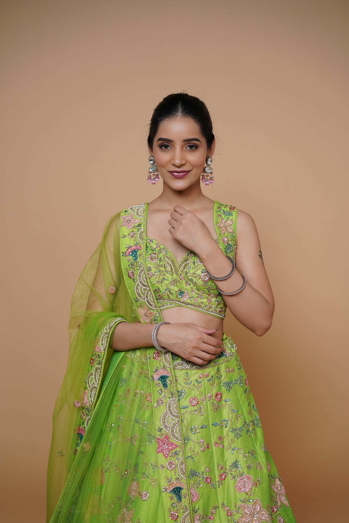 Trendy neon green mehendi outfit with custom detailing by Urban Dulhaniya