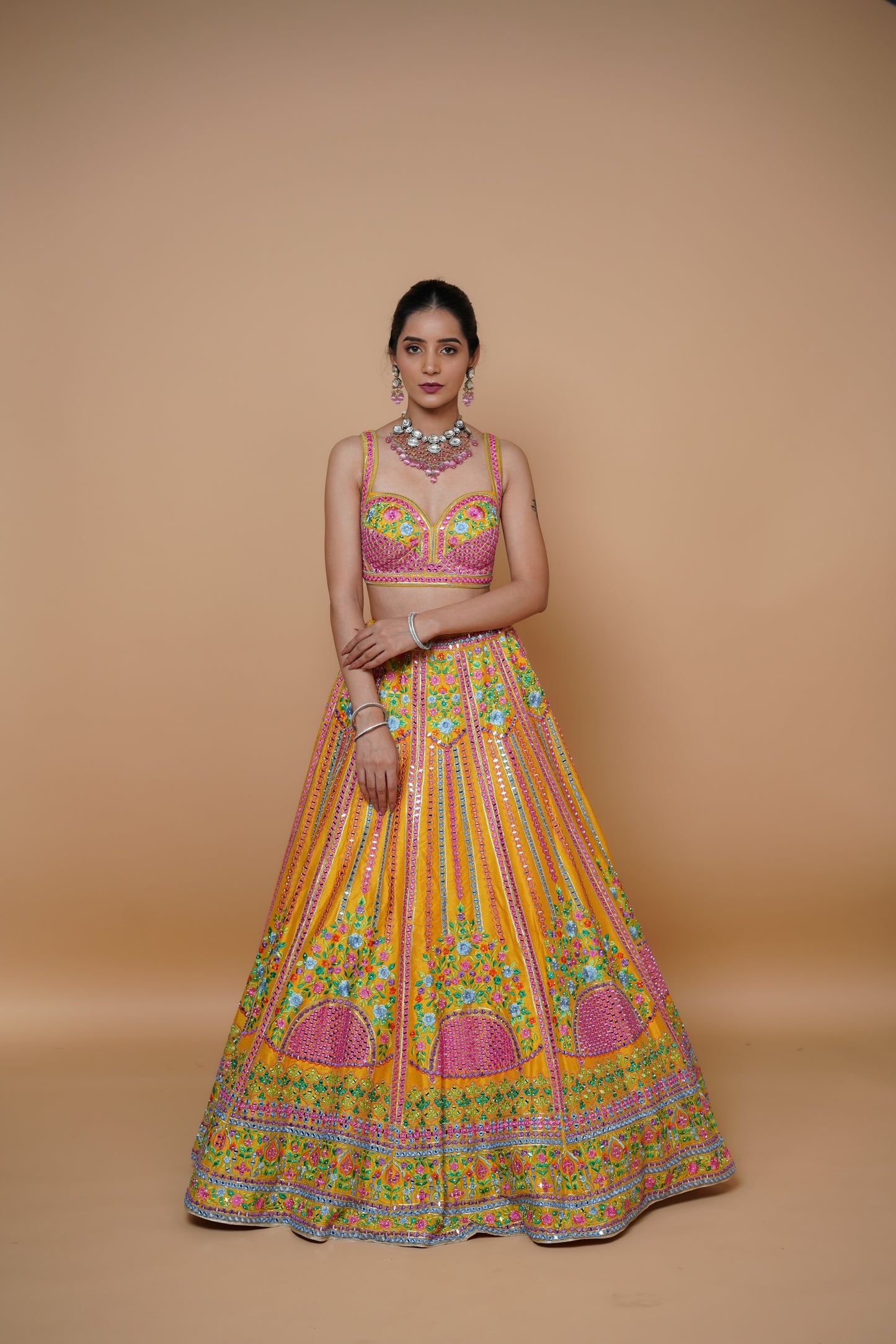 mustard yellow lehenga design with handwork and designer touch.