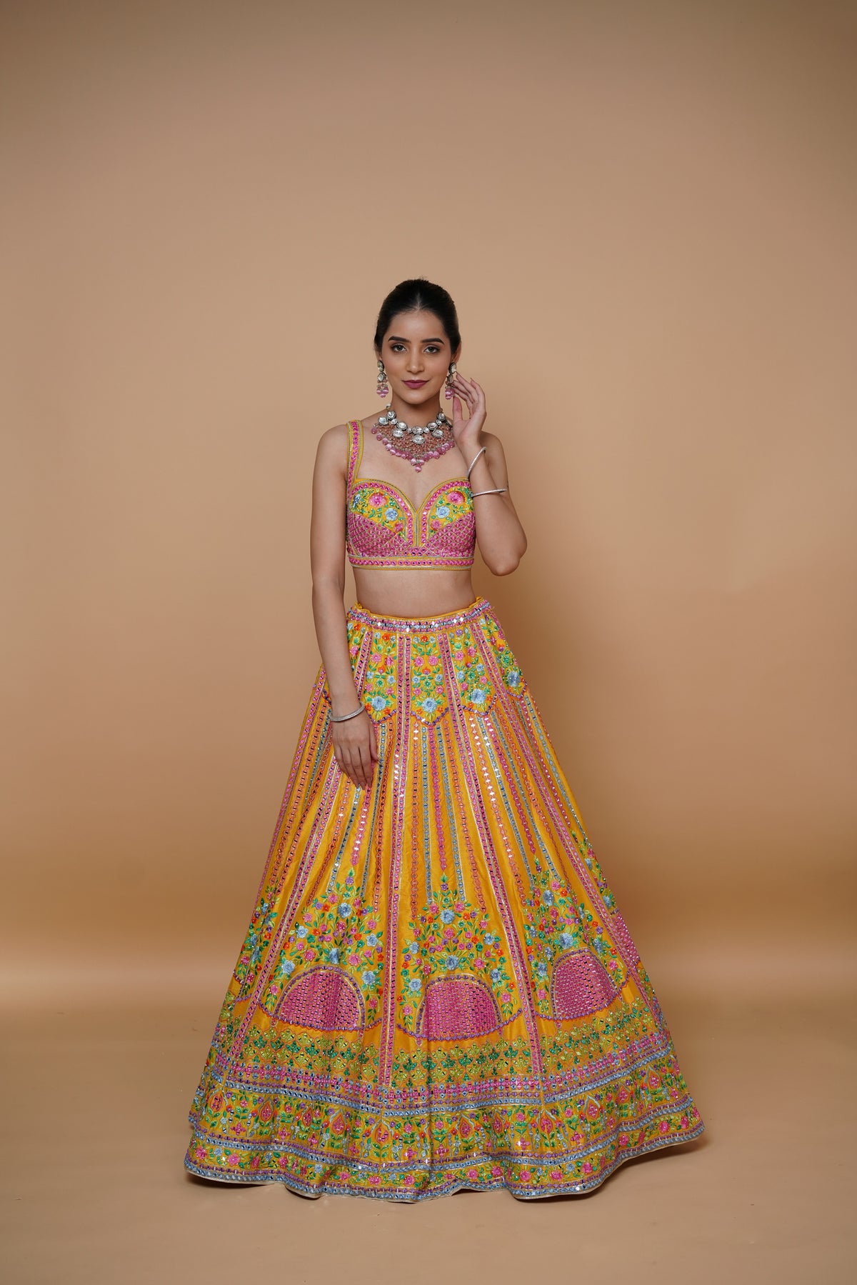 mustard yellow lehenga design with handwork and designer touch.
