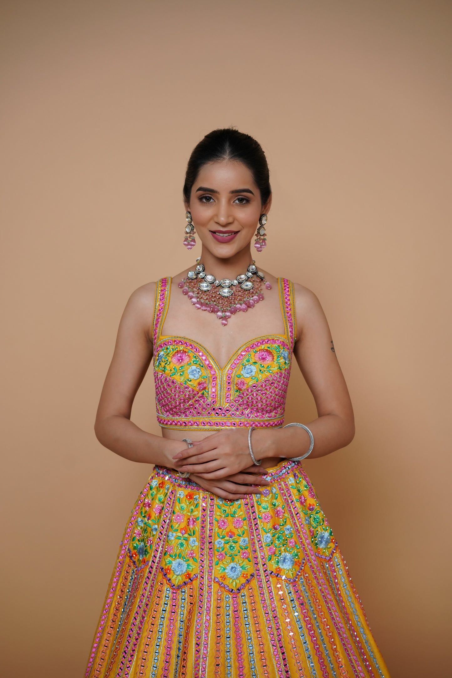 mustard yellow lehenga design with handwork and designer touch.