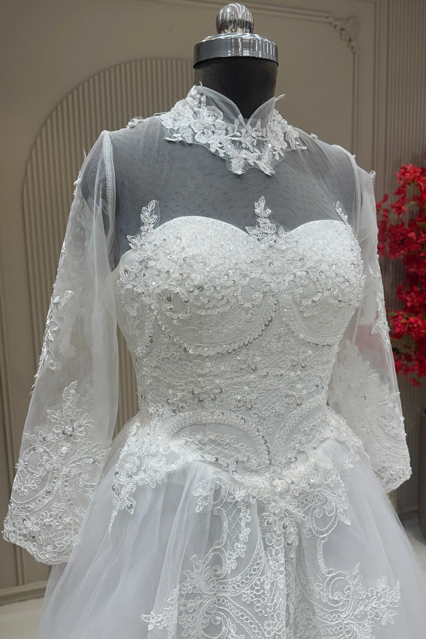 Angled bust detail off white net high collar lace dress designer bridal wear at Urban Dulhaniya Pune