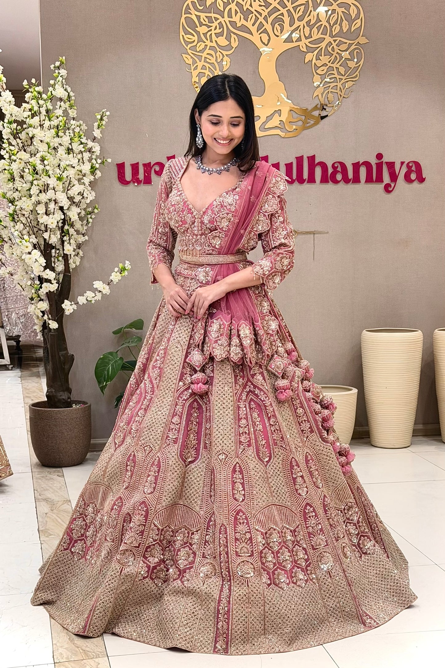 Luxury pink bridal lehenga Pune – zari embroidery handwork blouse gold panel skirt Urban Dulhaniya.
Pink bridal lehenga boutique Pune MG Road – zari and handwork set at Urban Dulhaniya Oswal Plaza.
Best pink bridal lehenga in Pune – zari embroidery and handwork blouse at Urban Dulhaniya boutique.
Rose pink wedding lehenga for pheras – zari handwork bridal set at Urban Dulhaniya Camp Pune