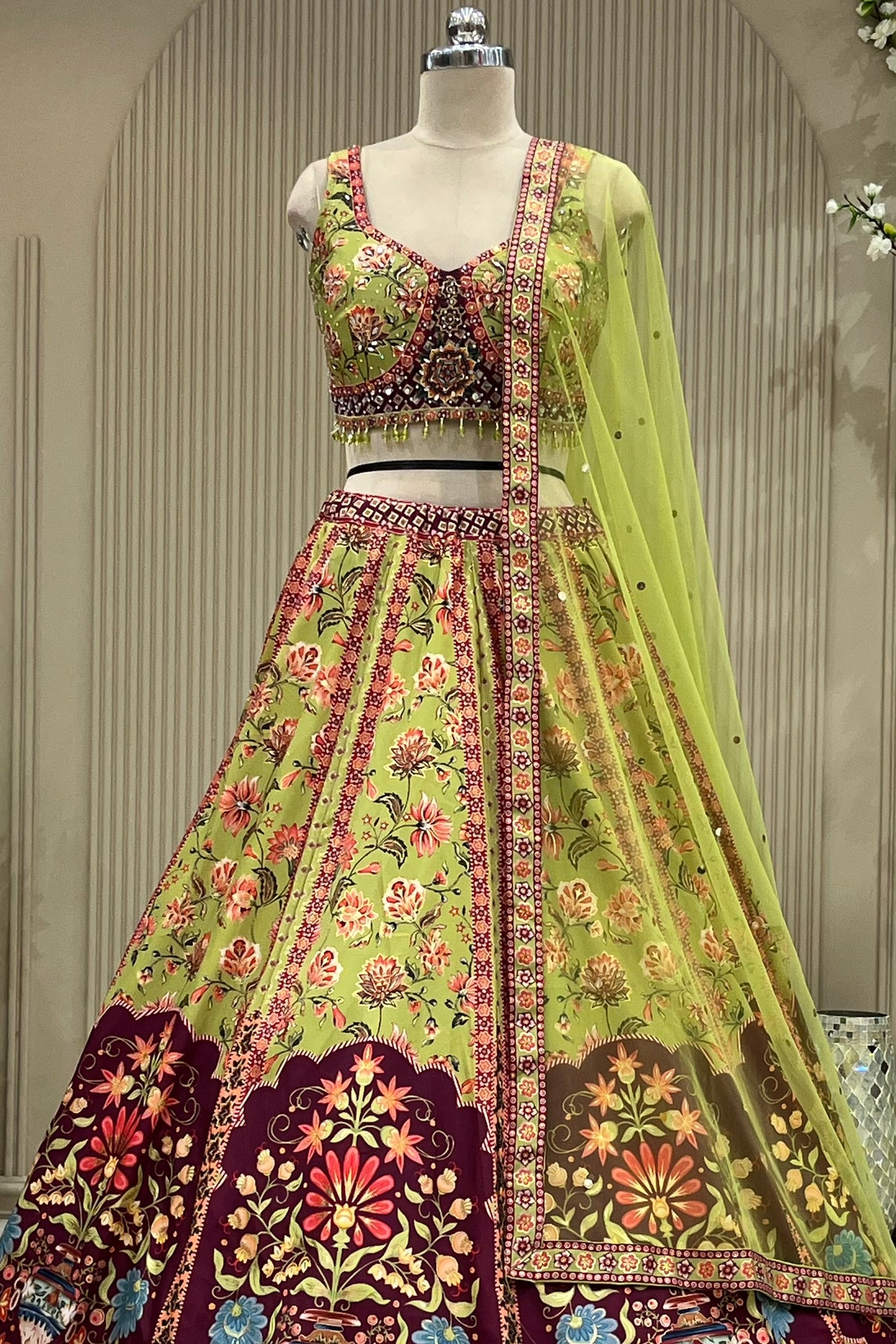 Close-up front view of mirror-work blouse and lehenga waistband with dupatta drape