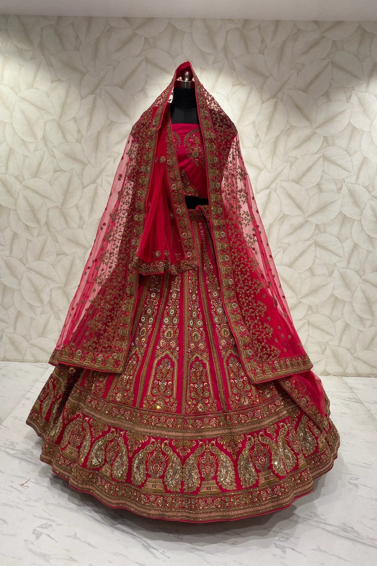 Rani Bridal Lehenga with peacock Motif on border with double dupatta
