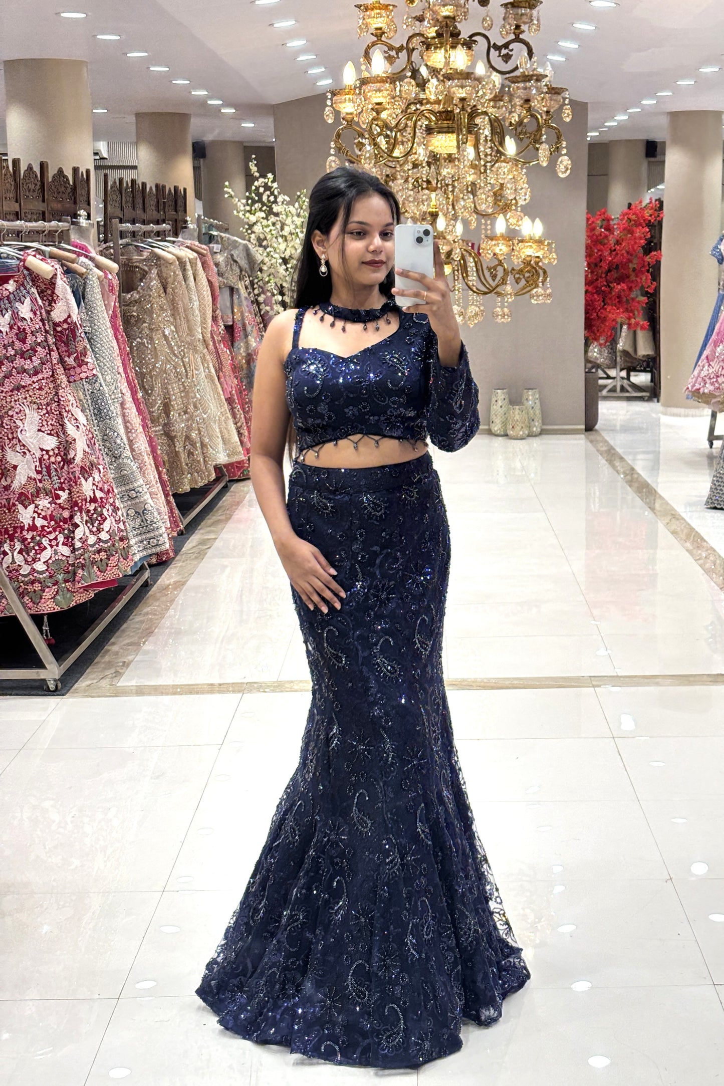 Full-body shot showcasing the figure-hugging mermaid silhouette and intricate beadwork of a premium midnight blue reception lehenga.