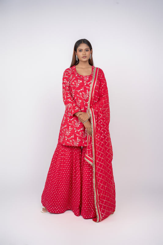  Front view of rani pink designer gharara suit for wedding guests by Urban Dulhaniya.