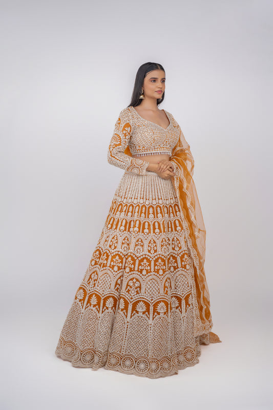  Front view of mustard yellow designer lehenga for haldi ceremony by Urban Dulhaniya.