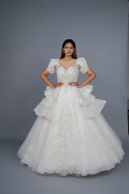 Front view of designer hand-stitched white Catholic bridal gown by Urban Dulhaniya.