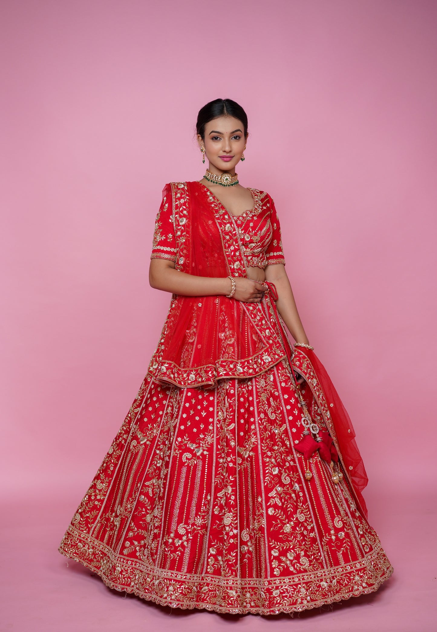 Full 5 meter flair of classic red silk wedding lehenga by Urban Dulhaniya