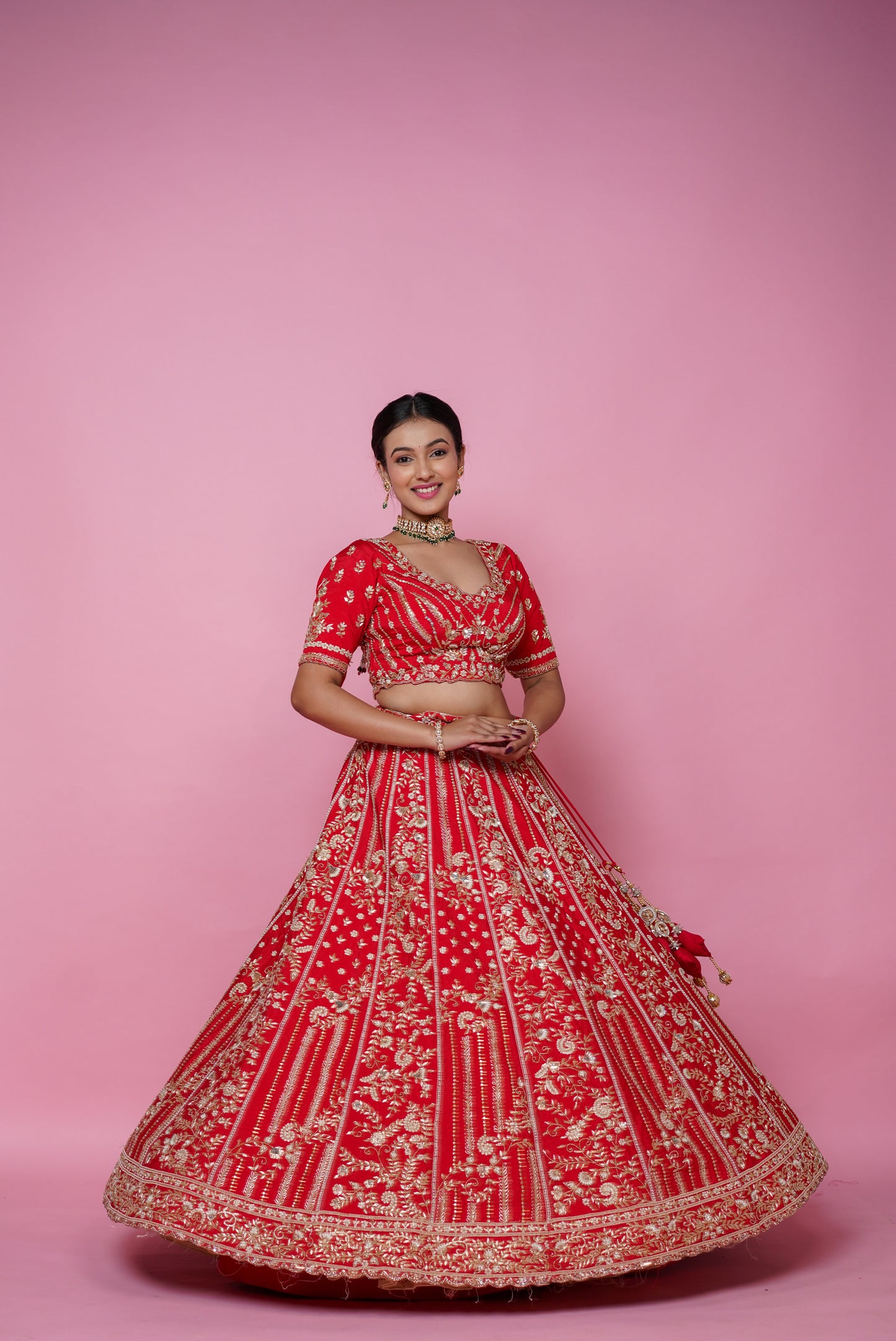 Full 5 meter flair of classic red silk wedding lehenga by Urban Dulhaniya