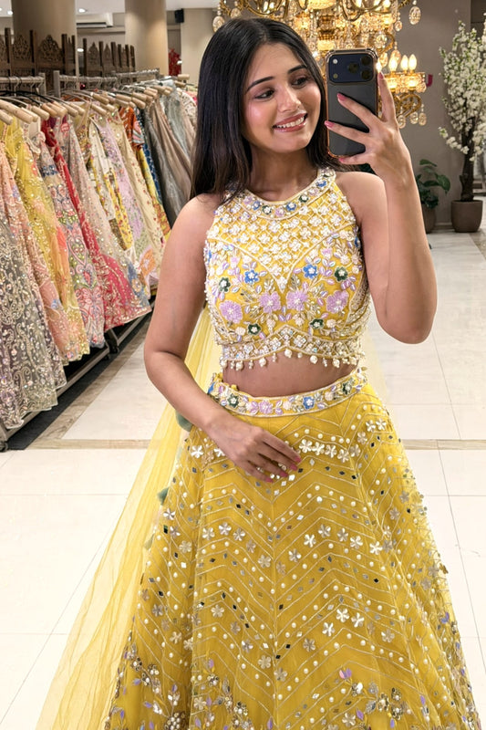 Mustard yellow halter lehenga blouse with 3D floral embroidery and pearl tassels – Urban Dulhaniya Pune