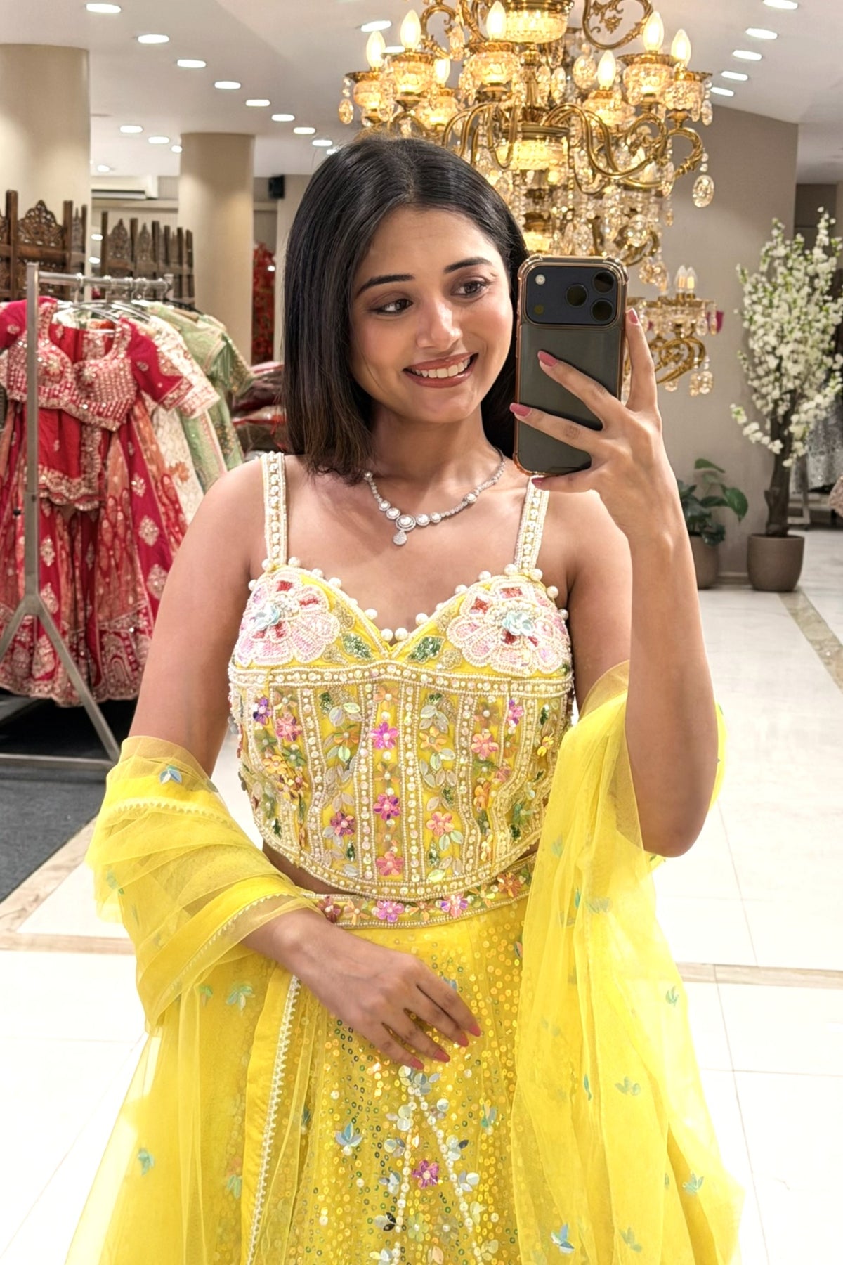 Yellow corset lehenga blouse with pearl neckline and multicolour floral embroidery – Urban Dulhaniya Pune