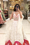 Ivory white butterfly lehenga set with silver zari scroll skirt and coral appliqué butterfly border — Urban Dulhaniya Pune