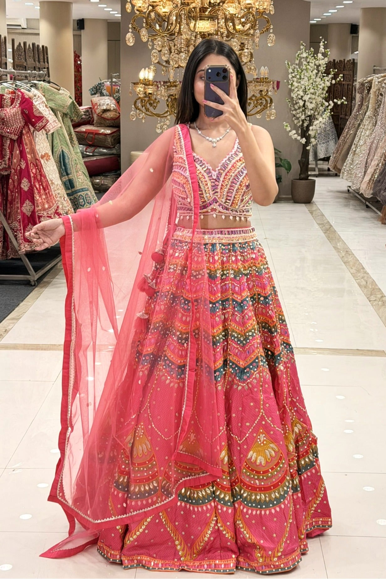 up)Multicolour Patola-inspired embroidered lehenga choli with pearl drop hem and coral net dupatta — Urban Dulhaniya Pune