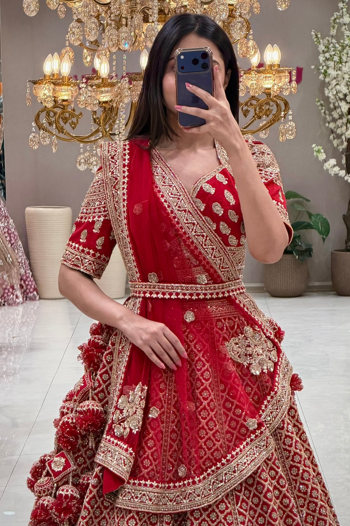Best red bridal lehenga in Pune – gold zardozi tiered skirt and wrap blouse at Urban Dulhaniya.
Red wedding lehenga for phera ceremony – traditional zardozi bridal set at Urban Dulhaniya Pune