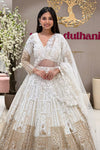 White bridal lehenga blouse with 3D floral V-neckline and sheer midriff panel – Urban Dulhaniya Pune