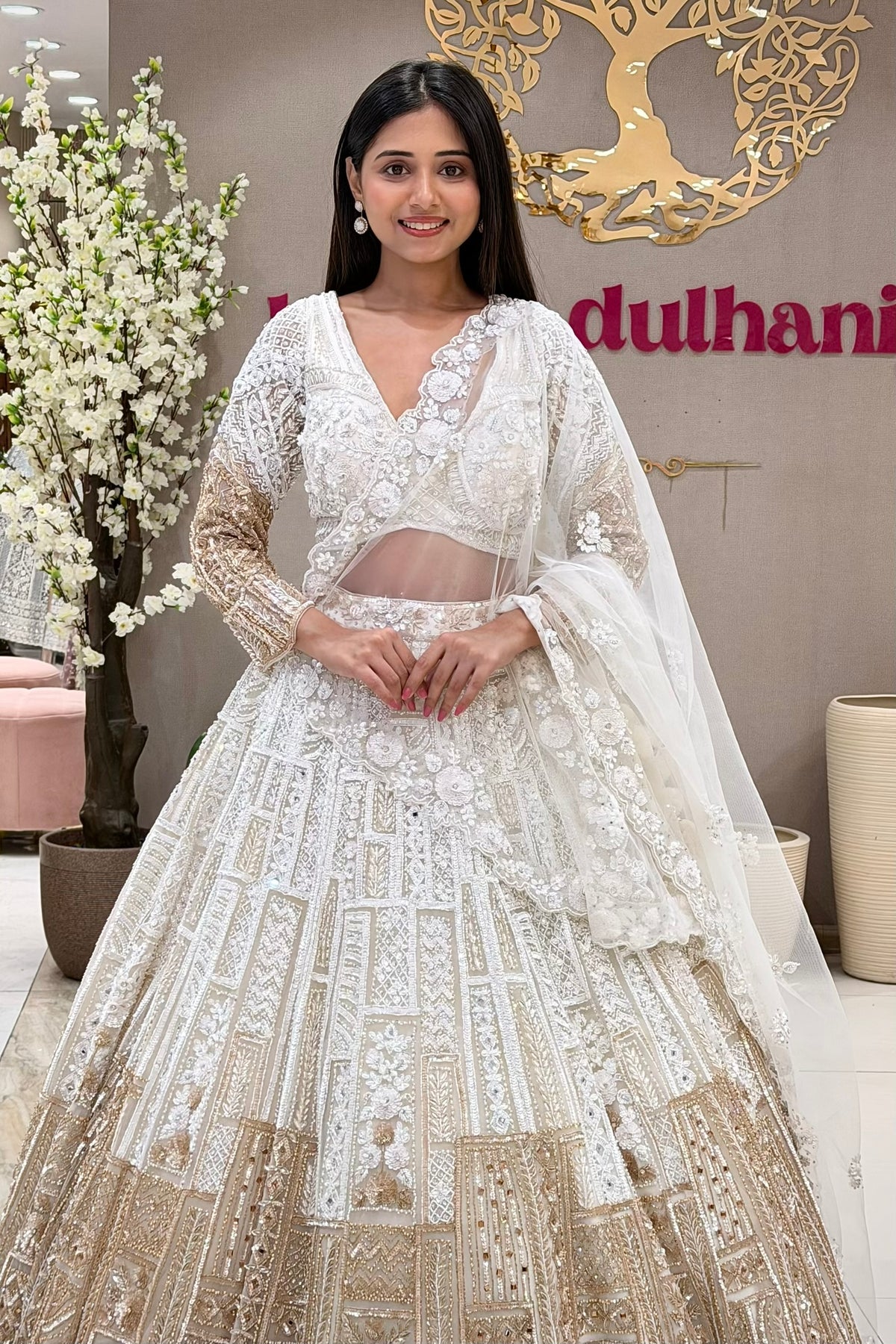 White bridal lehenga blouse with 3D floral V-neckline and sheer midriff panel – Urban Dulhaniya Pune