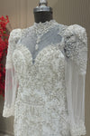 Bust detail off white net long sleeve pearl gown designer bridal wear at Urban Dulhaniya Pune