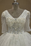 Front close-up off white net V-neck pearl dress premium ethnic wear from Urban Dulhaniya