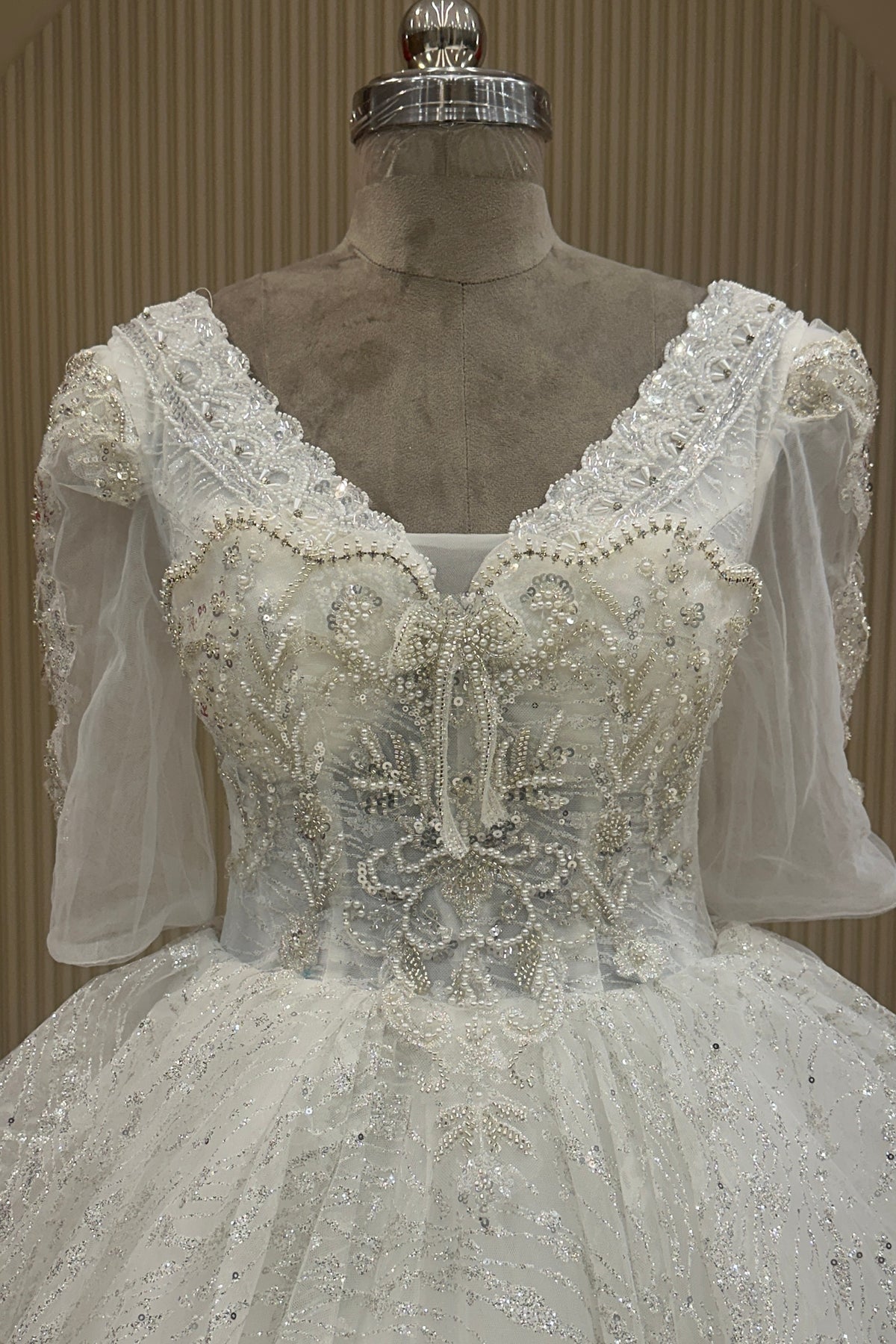 Front close-up off white net V-neck pearl dress premium ethnic wear from Urban Dulhaniya