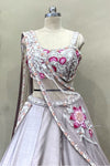 Close-up of choli featuring intricate poath moti, pearl work, and cut dana hand-embroidery on a mauve silk base.