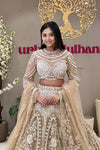 Luxury couture bridal lehenga Pune – champagne gold cage blouse and hand-embroidered skirt at Urban Dulhaniya