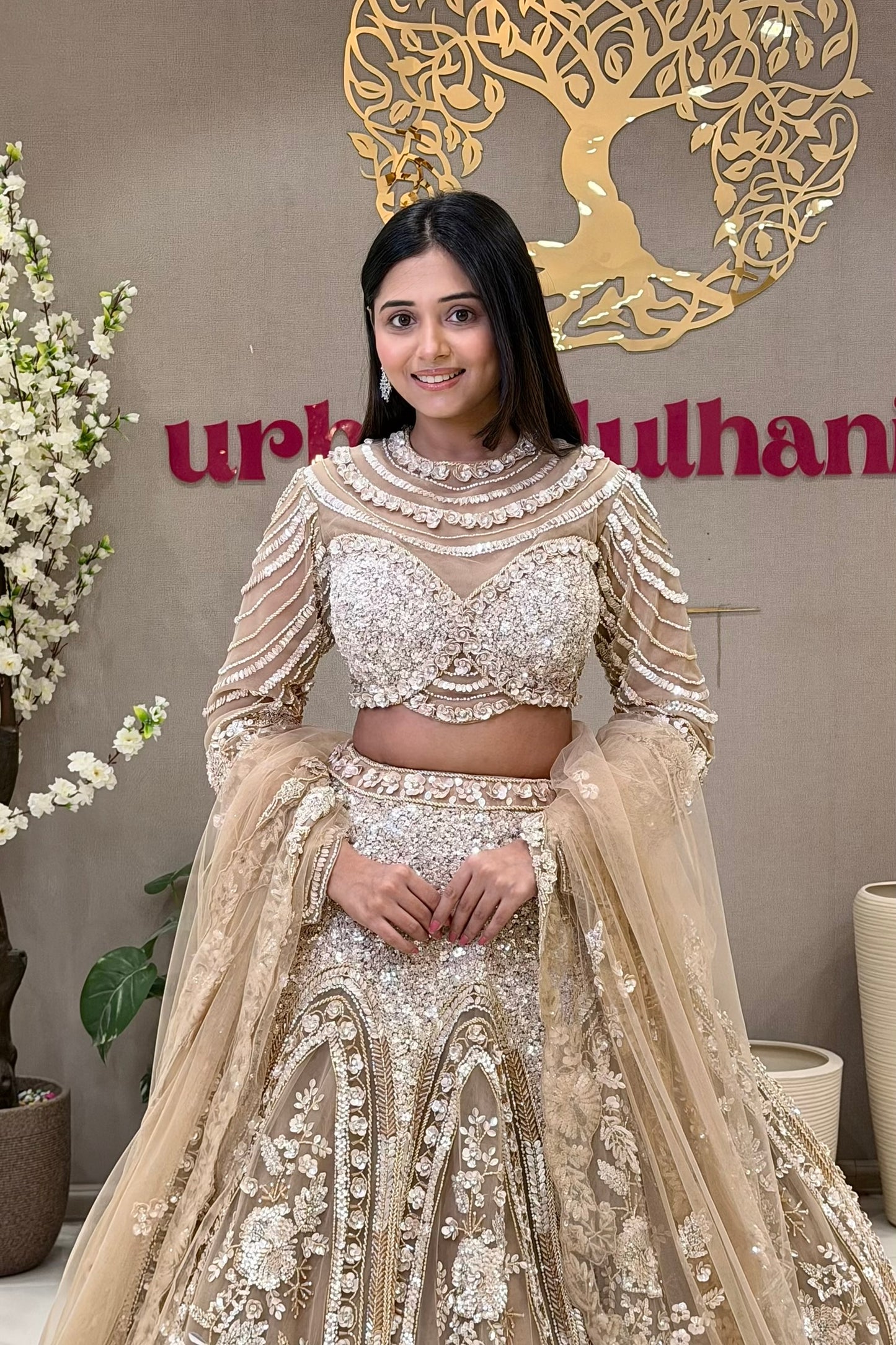 Luxury couture bridal lehenga Pune – champagne gold cage blouse and hand-embroidered skirt at Urban Dulhaniya