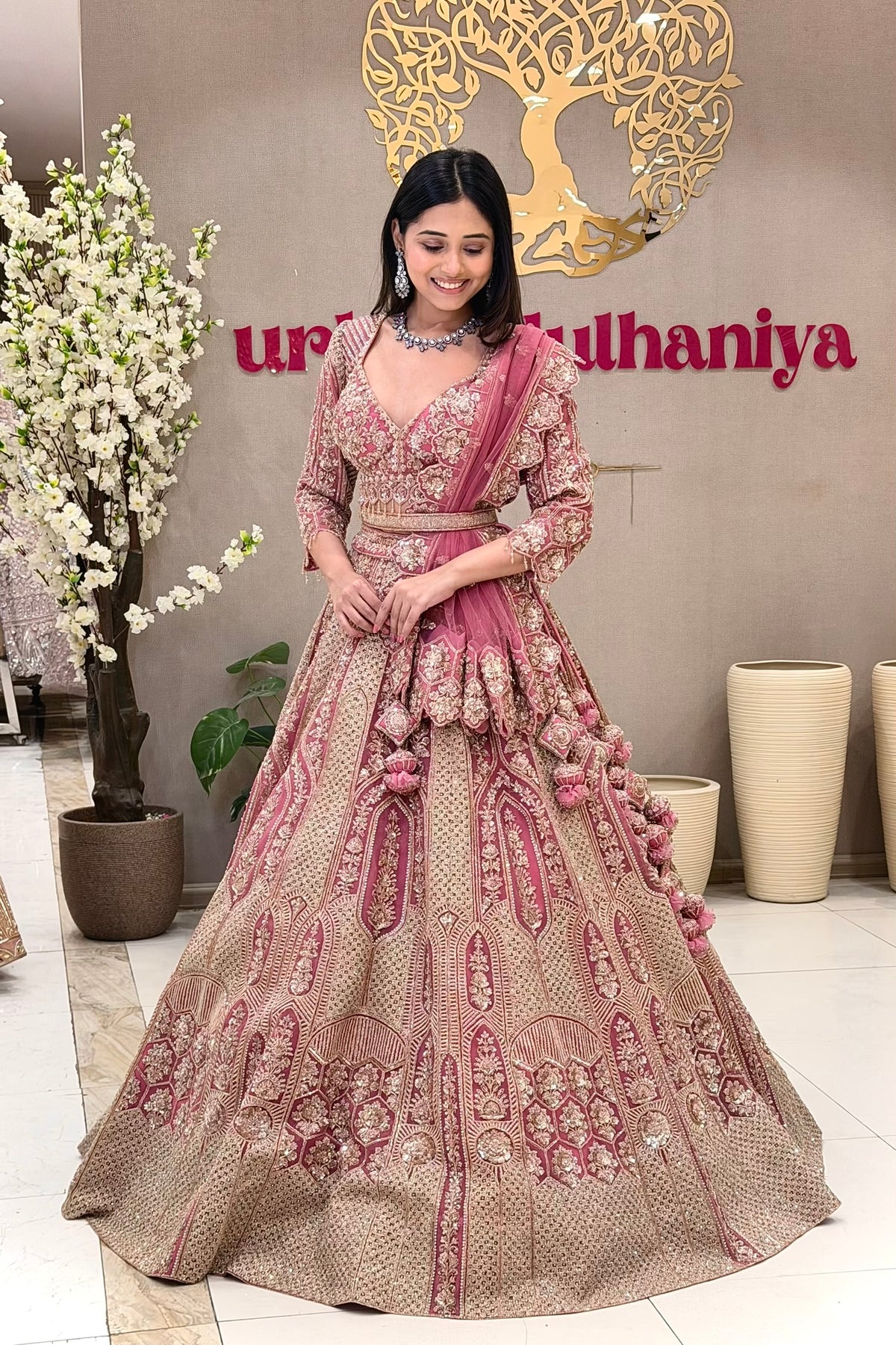 Luxury pink bridal lehenga Pune – zari embroidery handwork blouse gold panel skirt Urban Dulhaniya.
Pink bridal lehenga boutique Pune MG Road – zari and handwork set at Urban Dulhaniya Oswal Plaza.
Best pink bridal lehenga in Pune – zari embroidery and handwork blouse at Urban Dulhaniya boutique.
Rose pink wedding lehenga for pheras – zari handwork bridal set at Urban Dulhaniya Camp Pune