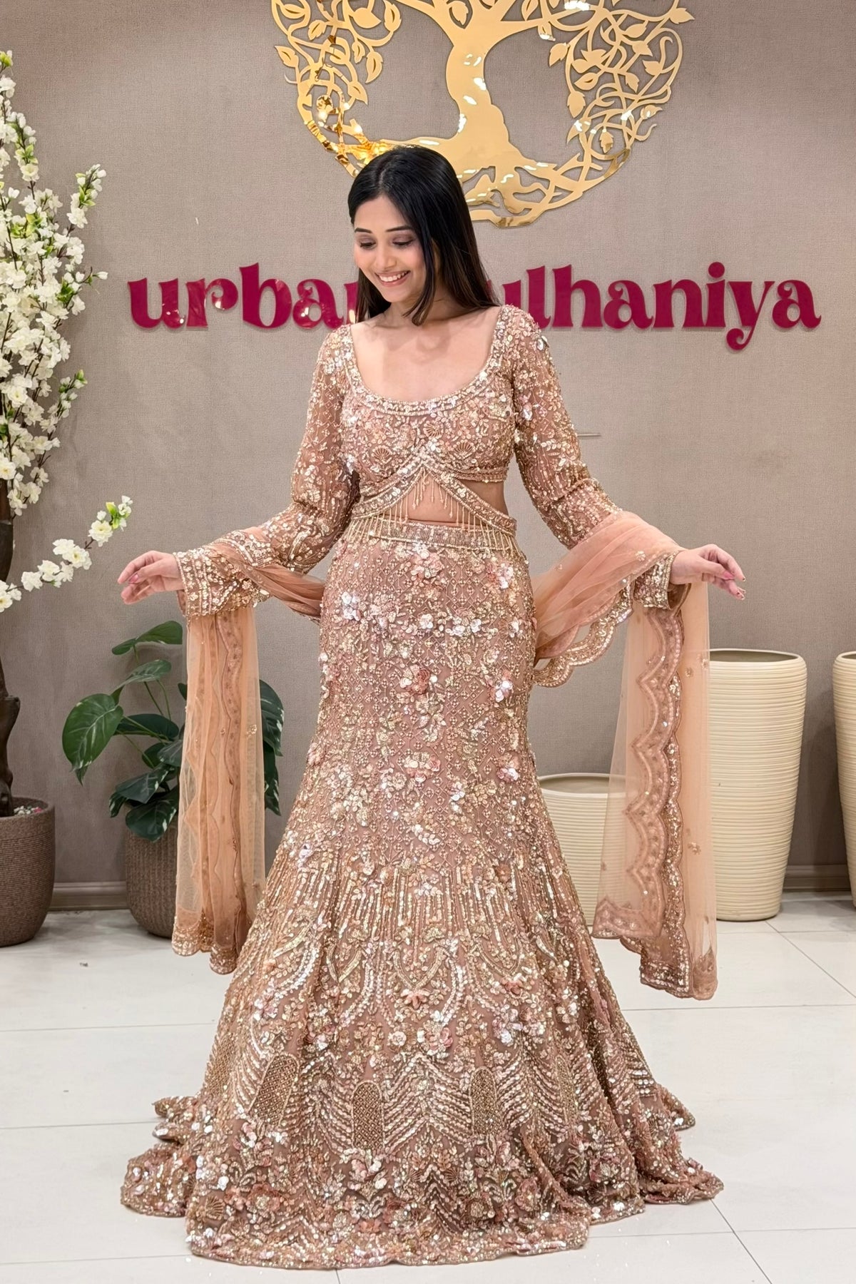 Luxury peach mermaid lehenga Pune rose gold sequin handwork blouse at Urban Dulhaniya bridal boutique