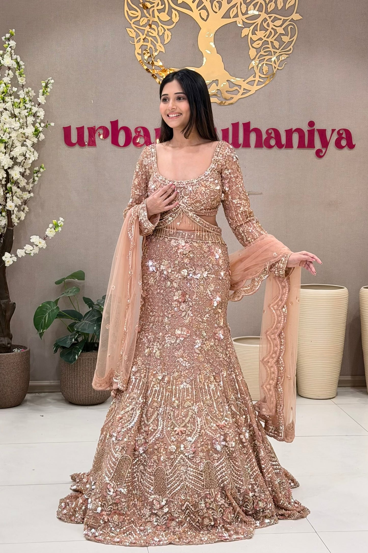 Full length peach rose gold mermaid lehenga with crystal tassel skirt at Urban Dulhaniya MG Road Pune