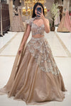 Nude gold occasion wear lehenga MG Road Pune – one-shoulder choker set at Urban Dulhaniya Oswal Plaza.
Modern nude reception lehenga India – one-shoulder choker blouse shimmer skirt at Urban Dulhaniya Pune
