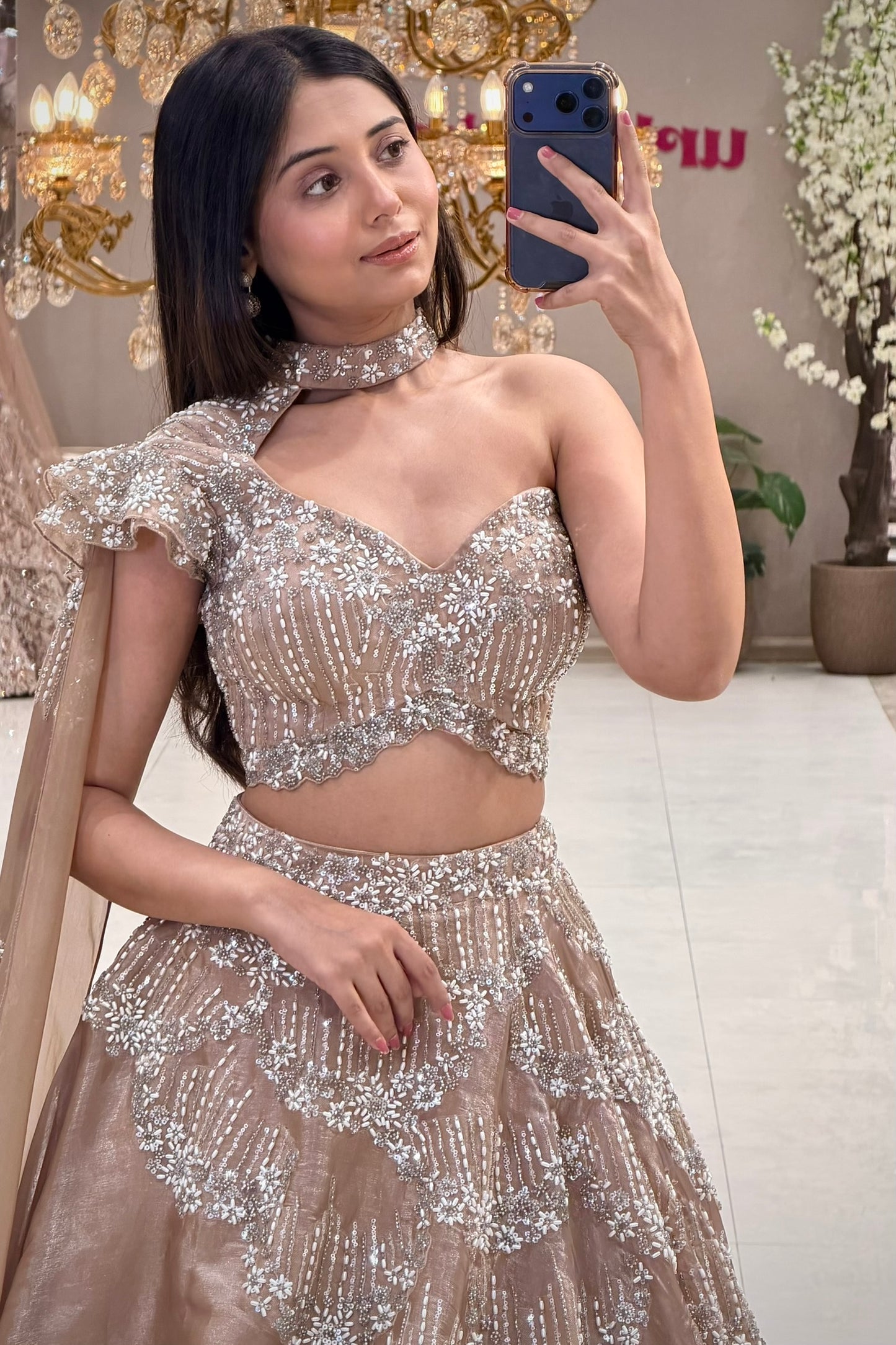 One-shoulder choker lehenga blouse with pearl handwork and ruffle cap sleeve, Urban Dulhaniya Pune